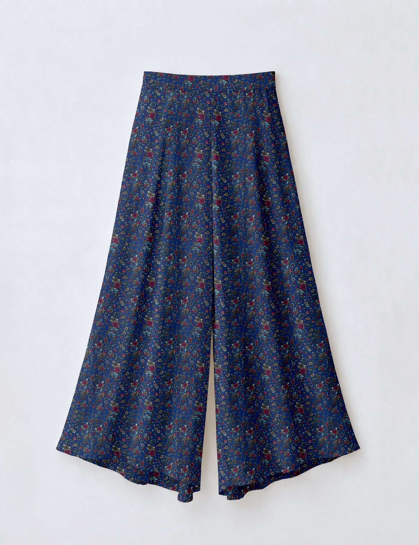Women's wide leg palazzo trousers with a fitted waistband and relaxed flowing silhouette.