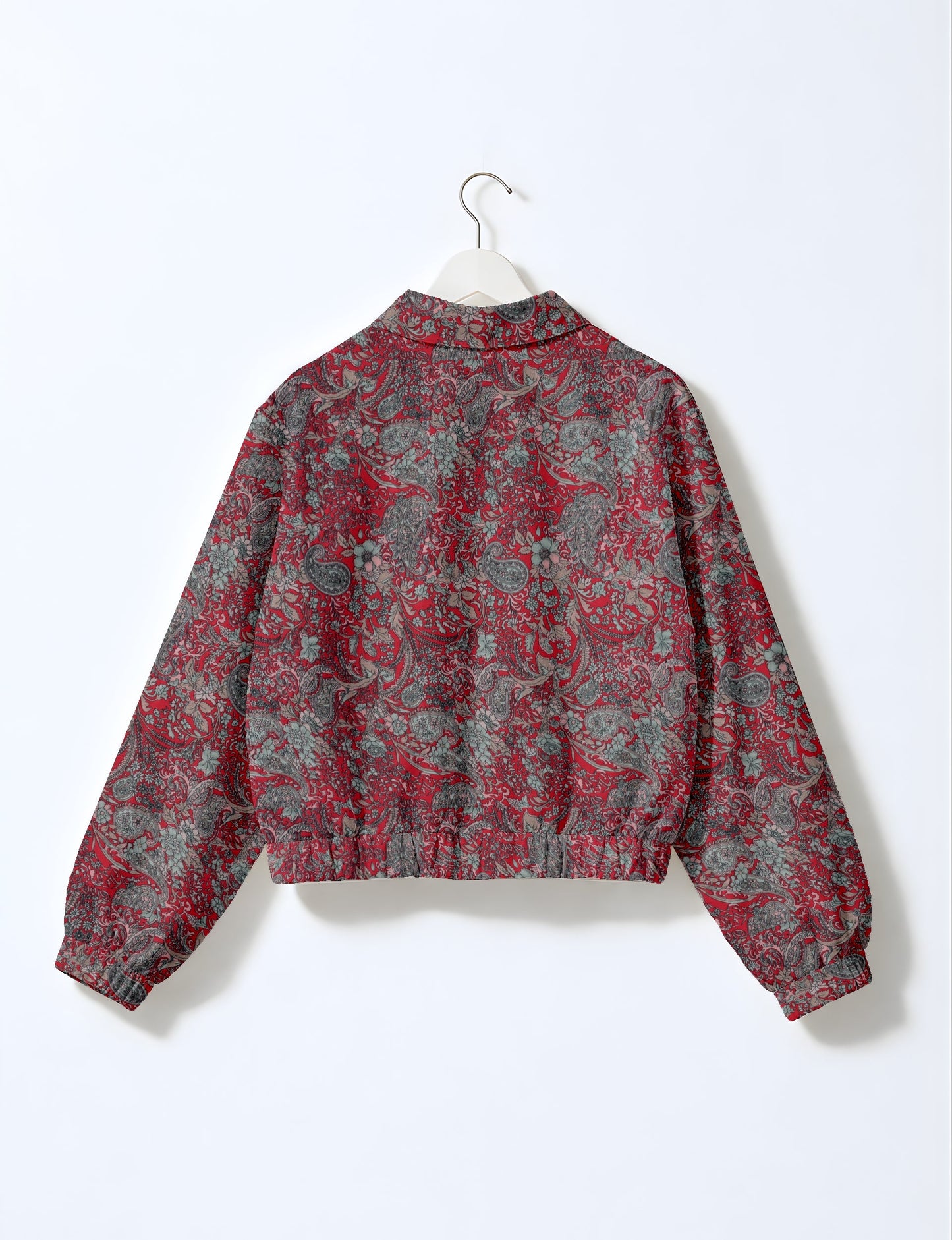 Upcycled Bomber Jacket made from recycled sari materials, featuring a cute cropped shape, elasticated hem and cuffs, and contrast sari print lining. Sustainable apparel promoting eco-friendly fashion and ethical clothing.