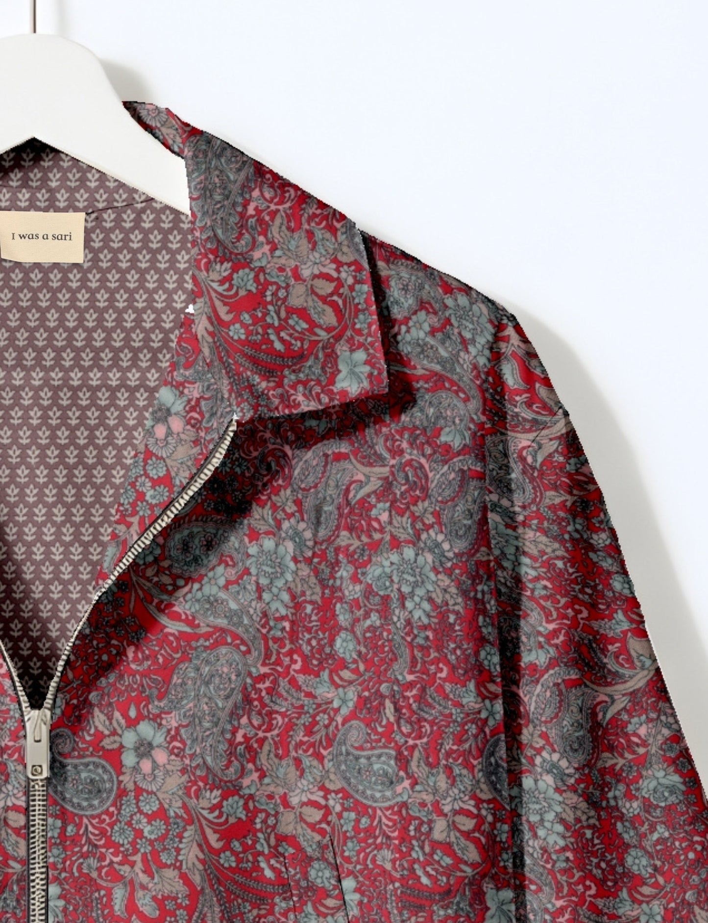Upcycled Bomber Jacket made from recycled sari materials, featuring a cute cropped shape, elasticated hem and cuffs, and contrast sari print lining. Sustainable apparel promoting eco-friendly fashion and ethical clothing.