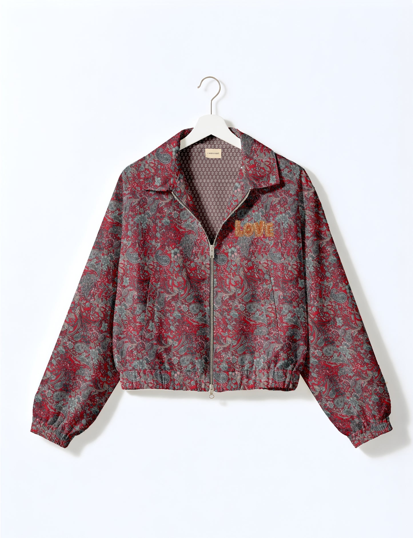 Love Bomber Jacket made from recycled fabric, featuring hand-stitched Aari embroidery. A unique piece of zero-waste clothing, part of the circular fashion movement. Designed with upcycled materials for a stylish yet environmentally friendly clothing choice.