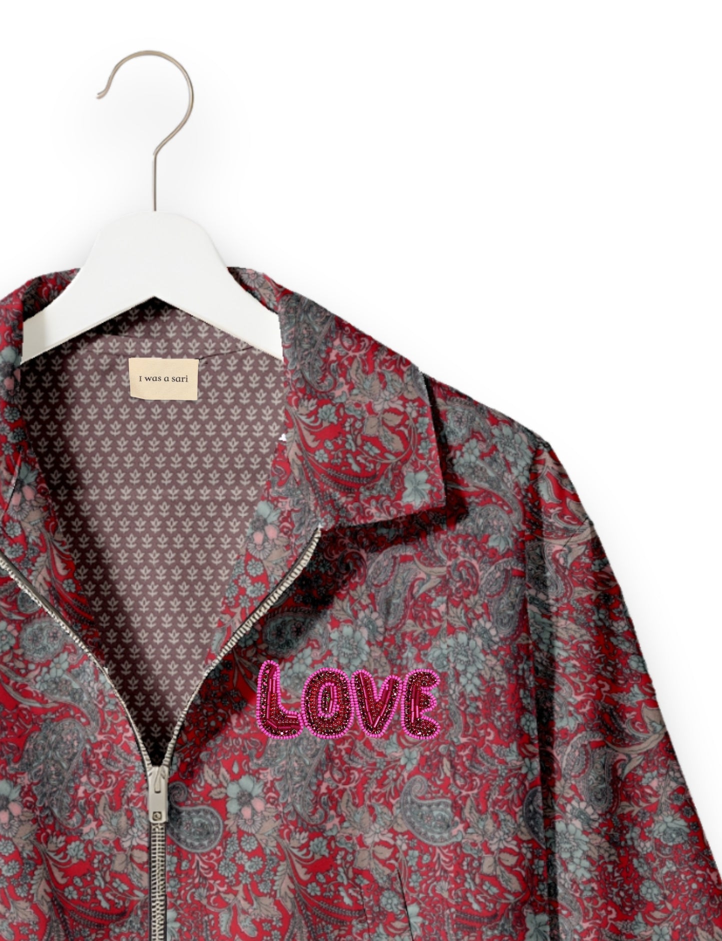 Love Bomber Jacket made from recycled fabric, featuring hand-stitched Aari embroidery. A unique piece of zero-waste clothing, part of the circular fashion movement. Designed with upcycled materials for a stylish yet environmentally friendly clothing choice.