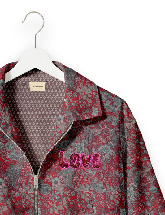 Love Bomber Jacket made from recycled fabric, featuring hand-stitched Aari embroidery. A unique piece of zero-waste clothing, part of the circular fashion movement. Designed with upcycled materials for a stylish yet environmentally friendly clothing choice.