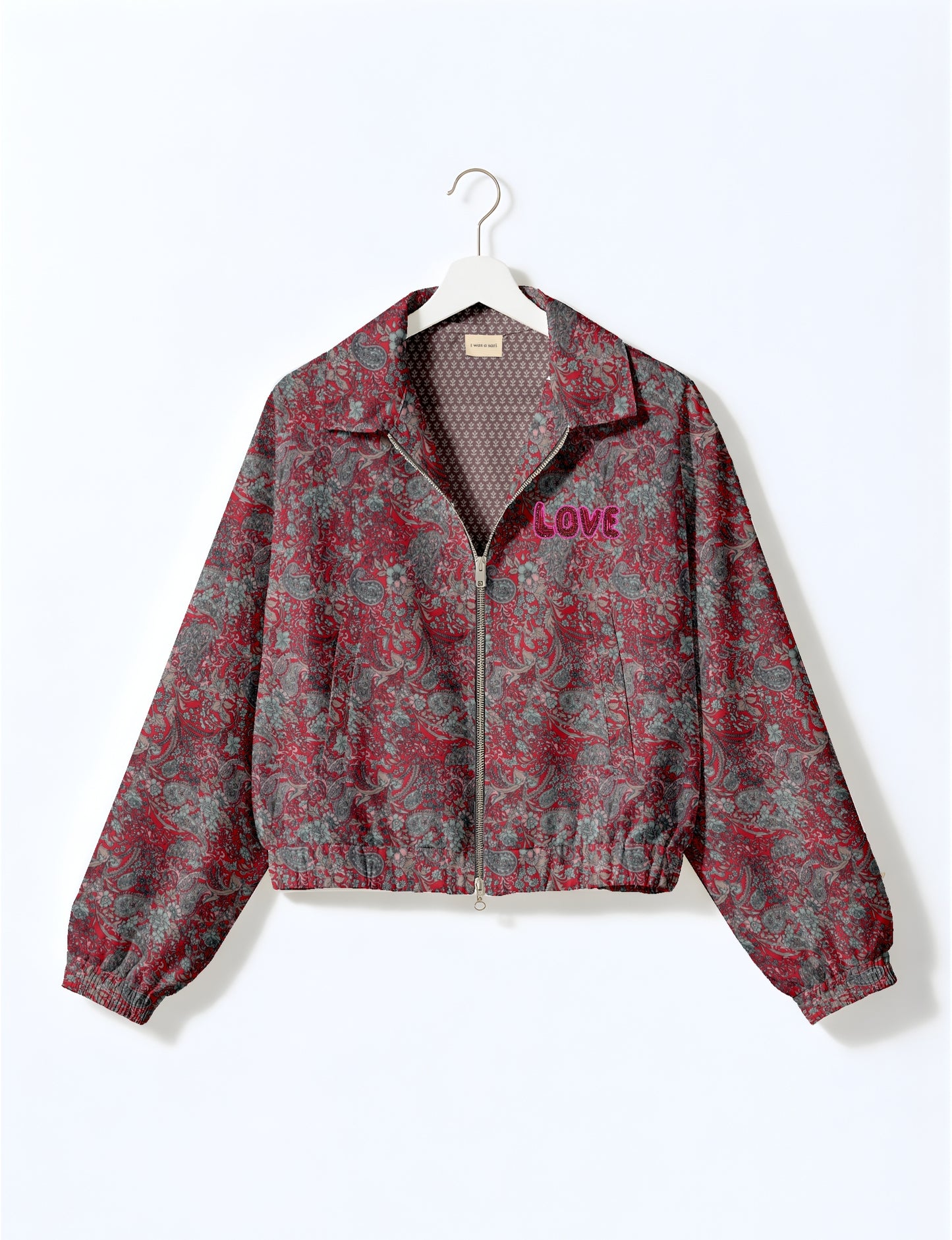Love Bomber Jacket made from recycled fabric, featuring hand-stitched Aari embroidery. A unique piece of zero-waste clothing, part of the circular fashion movement. Designed with upcycled materials for a stylish yet environmentally friendly clothing choice.