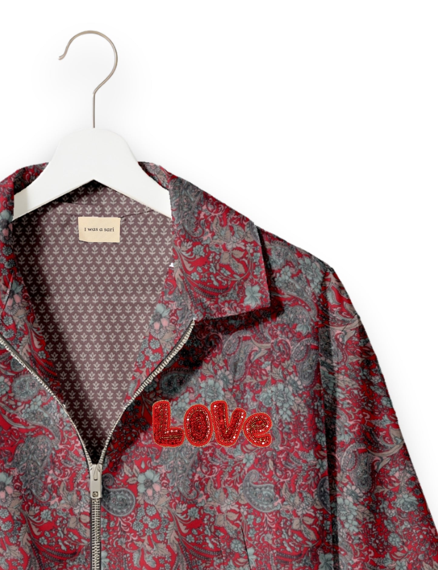 Love Bomber Jacket made from recycled fabric, featuring hand-stitched Aari embroidery. A unique piece of zero-waste clothing, part of the circular fashion movement. Designed with upcycled materials for a stylish yet environmentally friendly clothing choice.