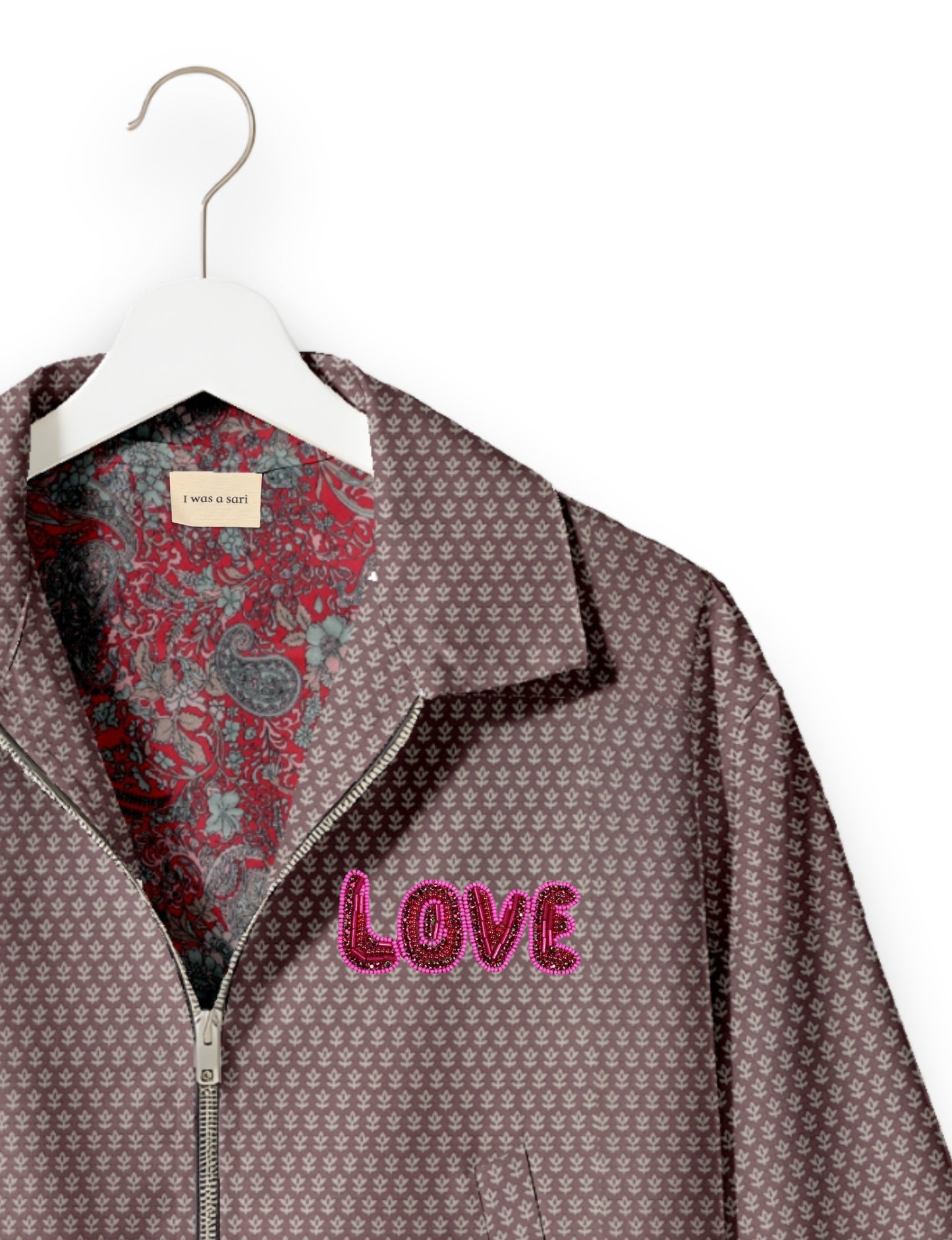 Love Bomber Jacket made from recycled fabric, featuring hand-stitched Aari embroidery. A unique piece of zero-waste clothing, part of the circular fashion movement. Designed with upcycled materials for a stylish yet environmentally friendly clothing choice.