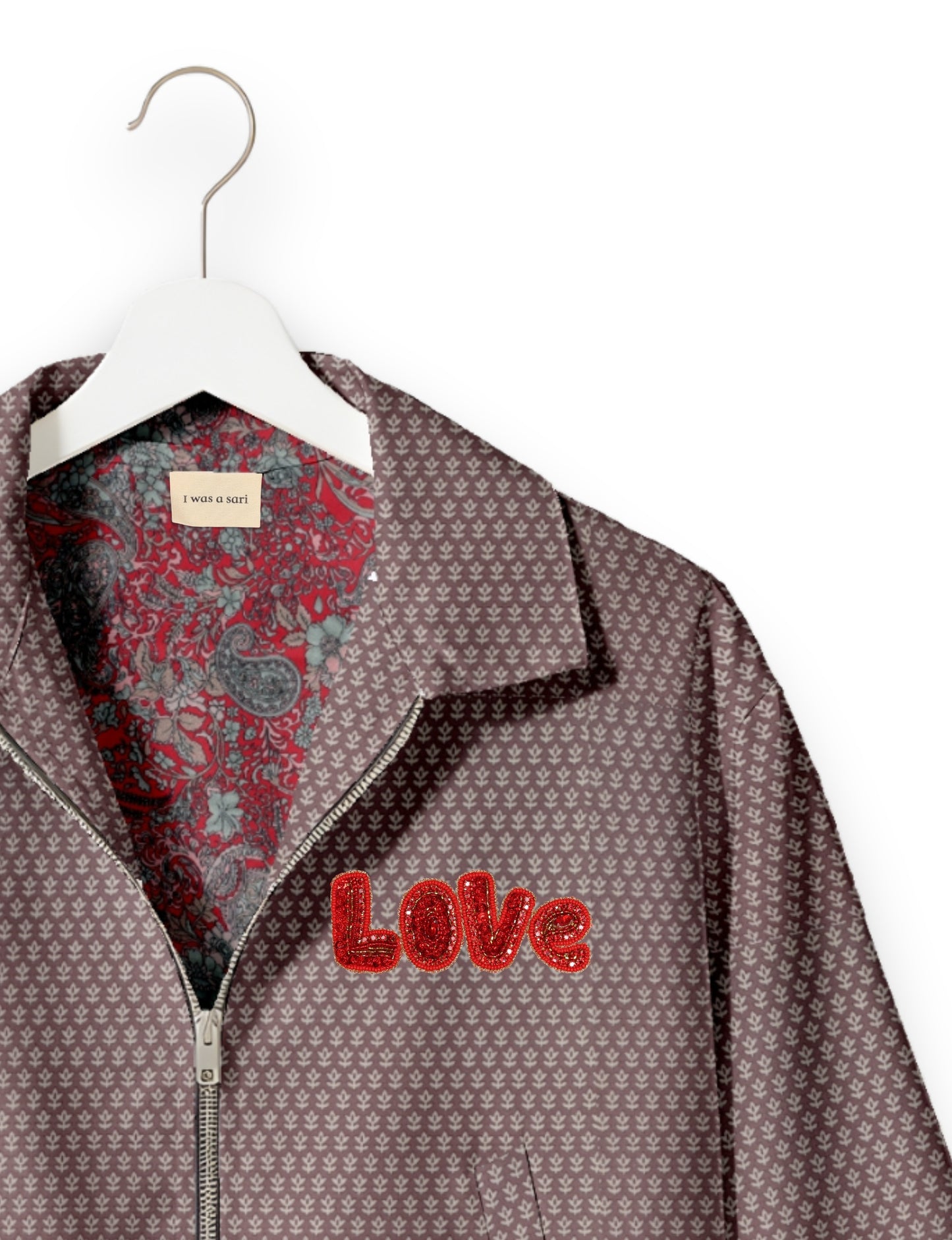 Love Bomber Jacket made from recycled fabric, featuring hand-stitched Aari embroidery. A unique piece of zero-waste clothing, part of the circular fashion movement. Designed with upcycled materials for a stylish yet environmentally friendly clothing choice.
