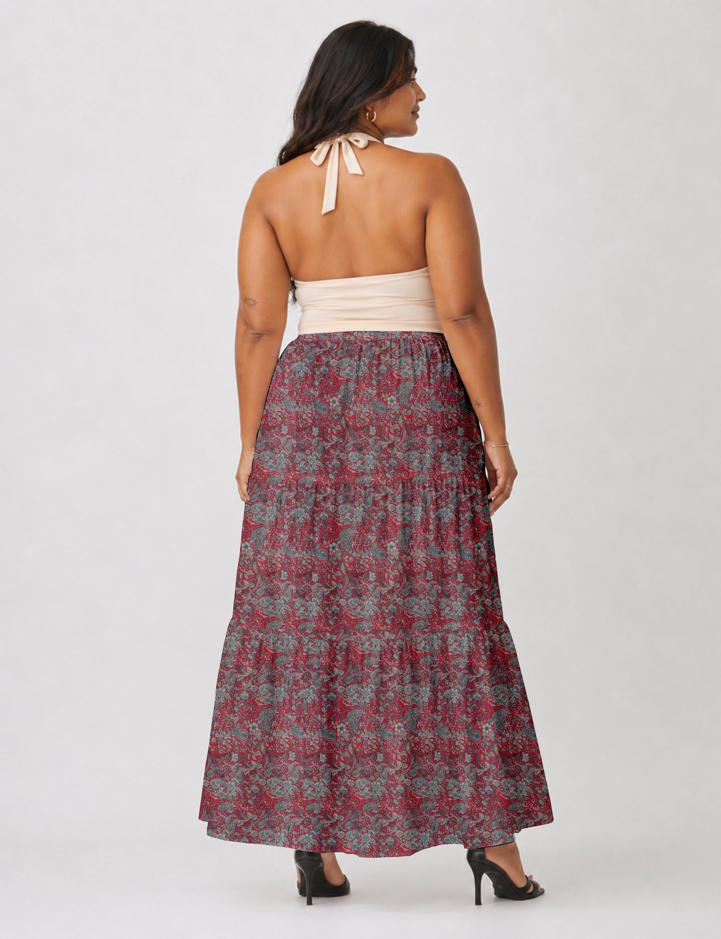 Midi tiered skirt with fitted waistband, soft knife pleats, flared silhouette, side seam pockets, and ankle-length hem