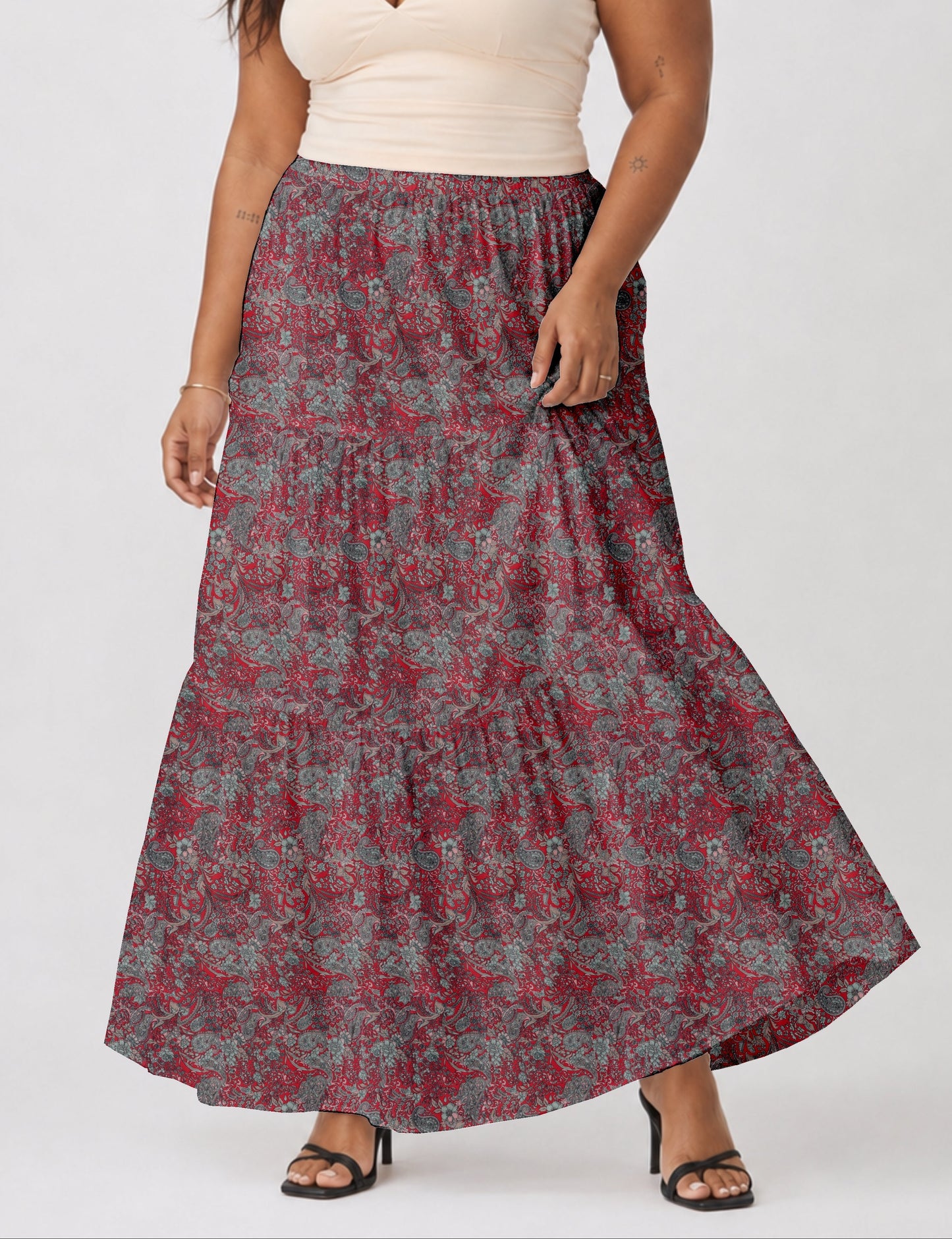 Midi tiered skirt with fitted waistband, soft knife pleats, flared silhouette, side seam pockets, and ankle-length hem