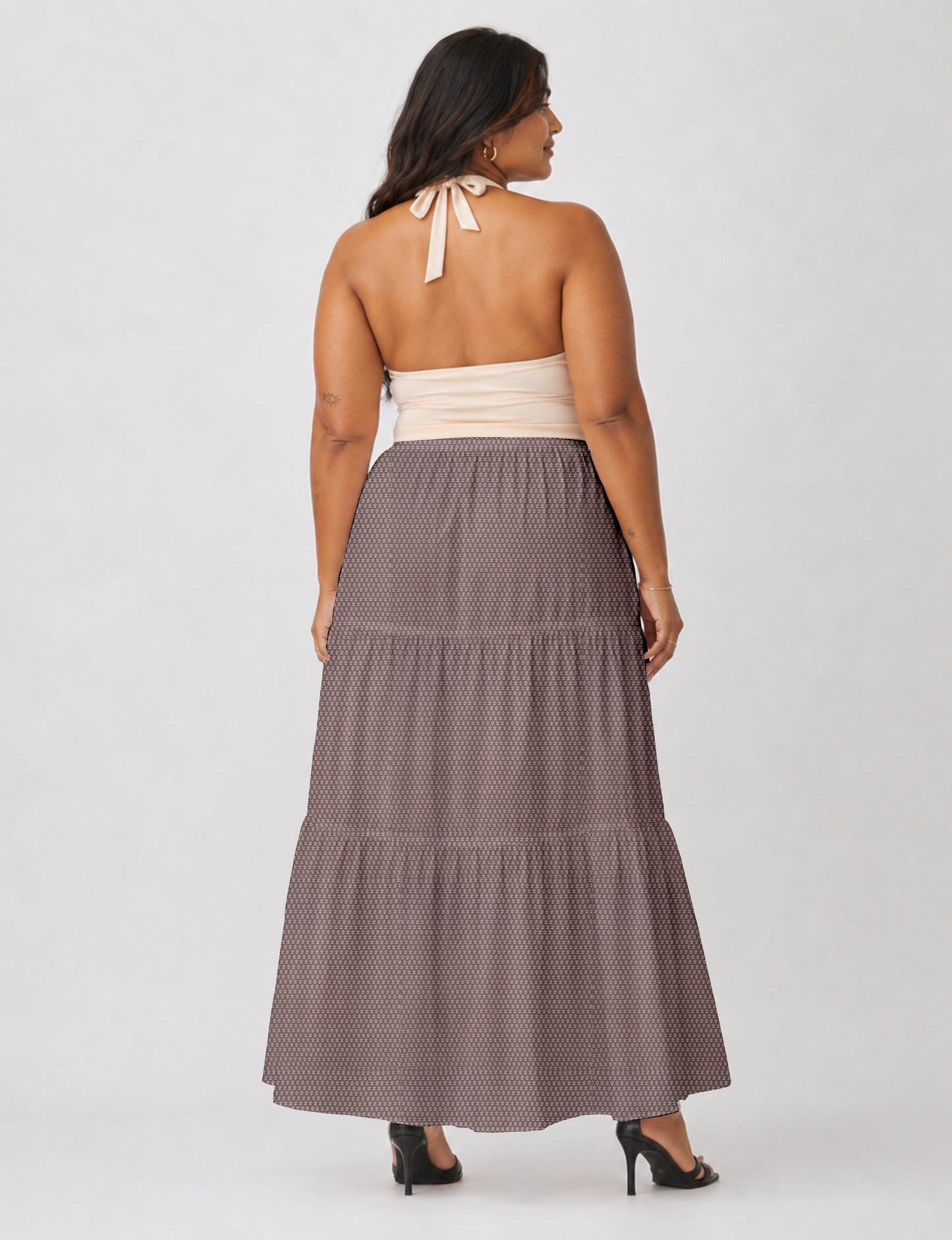 Midi tiered skirt with fitted waistband, soft knife pleats, flared silhouette, side seam pockets, and ankle-length hem