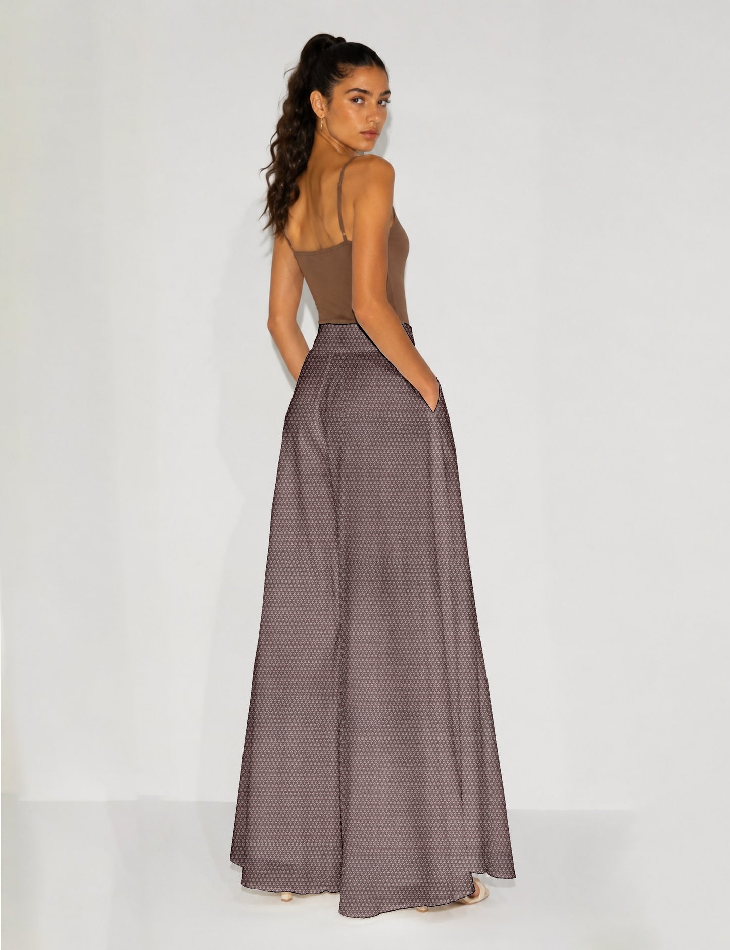 Women's wide leg palazzo trousers with a fitted waistband and relaxed flowing silhouette.