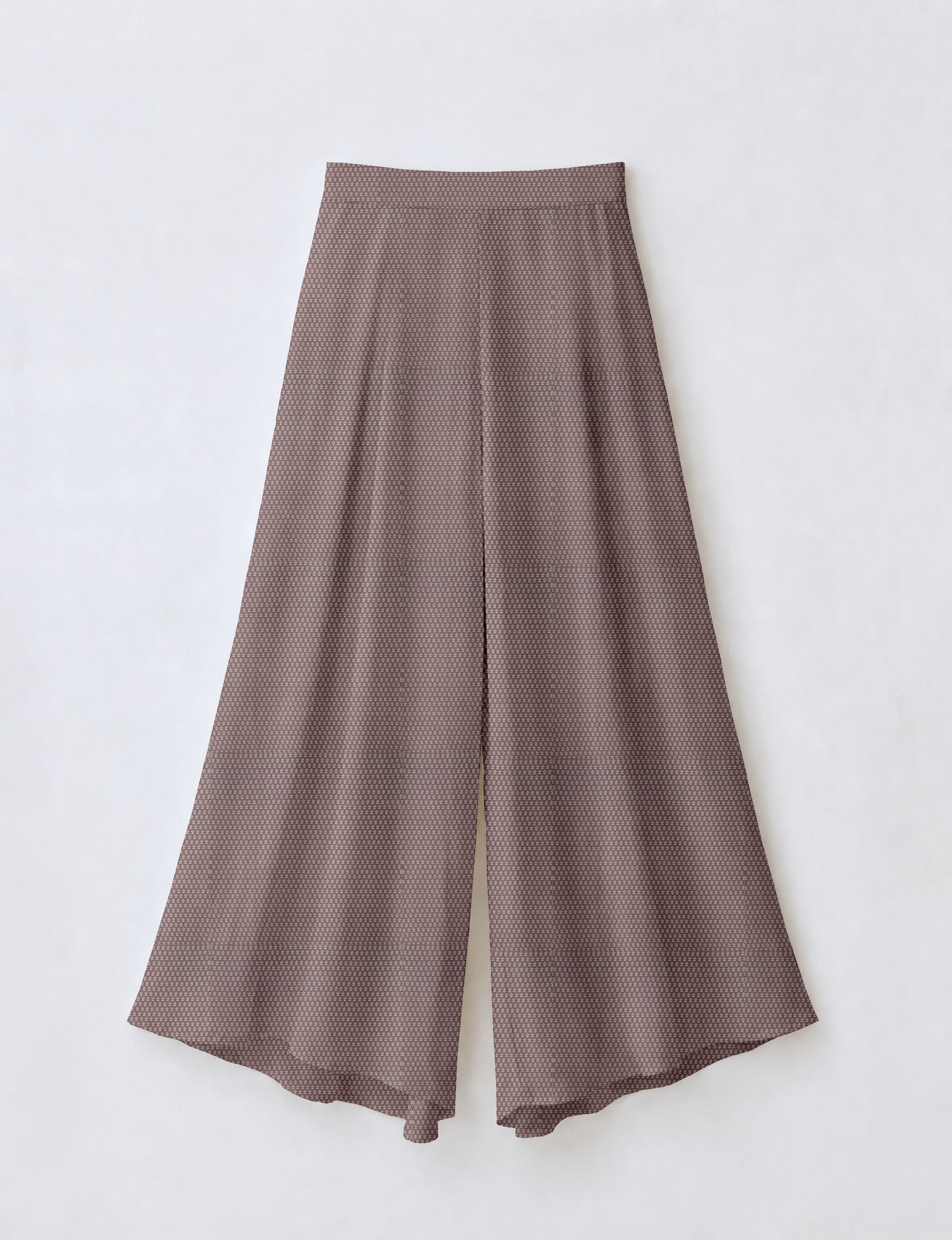 Women's wide leg palazzo trousers with a fitted waistband and relaxed flowing silhouette.