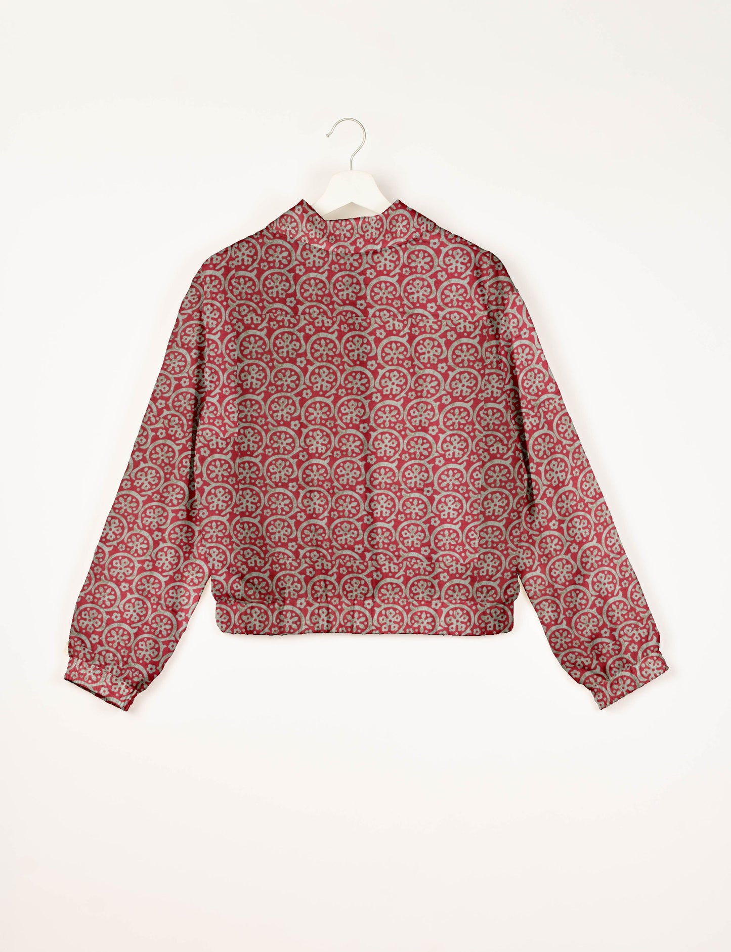 Upcycled Bomber Jacket made from recycled sari materials, featuring a cute cropped shape, elasticated hem and cuffs, and contrast sari print lining. Sustainable apparel promoting eco-friendly fashion and ethical clothing.
