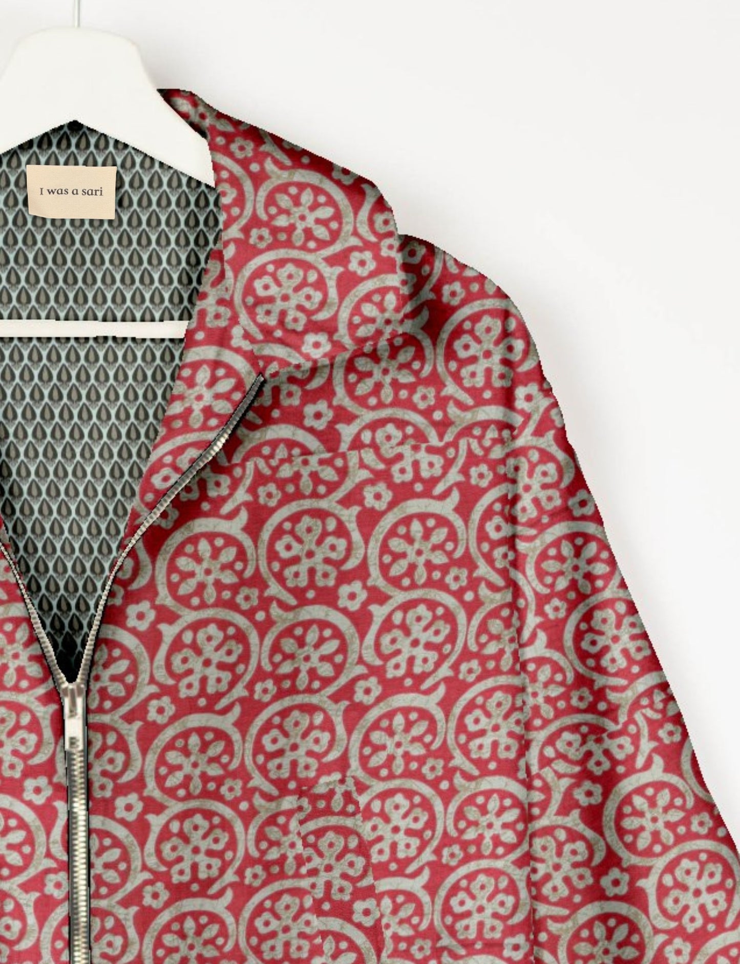 Upcycled Bomber Jacket made from recycled sari materials, featuring a cute cropped shape, elasticated hem and cuffs, and contrast sari print lining. Sustainable apparel promoting eco-friendly fashion and ethical clothing.