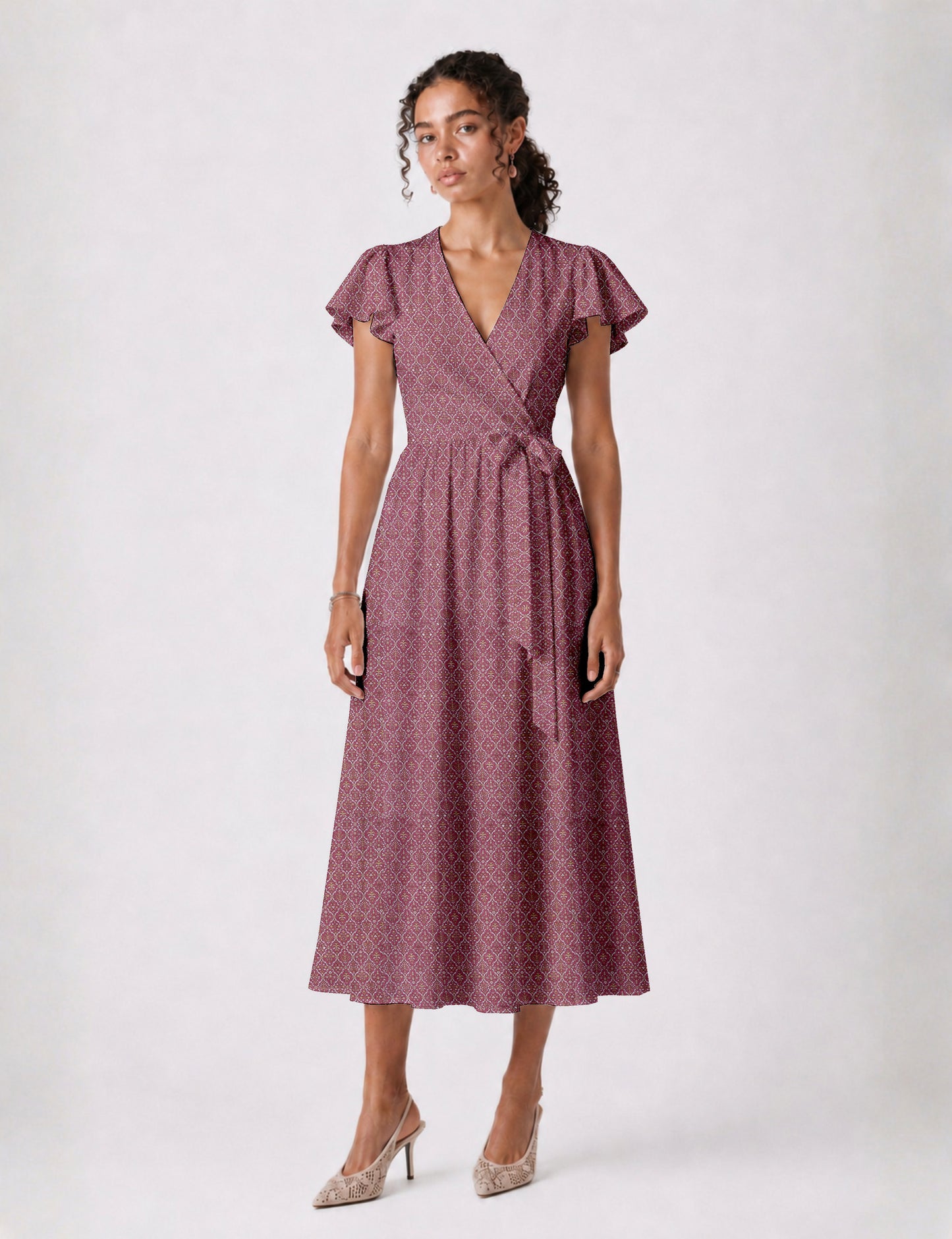 Elegant midi wrap dress with a V-neckline, adjustable waist tie, fitted bodice, and flared skirt for a timeless, flattering silhouette.