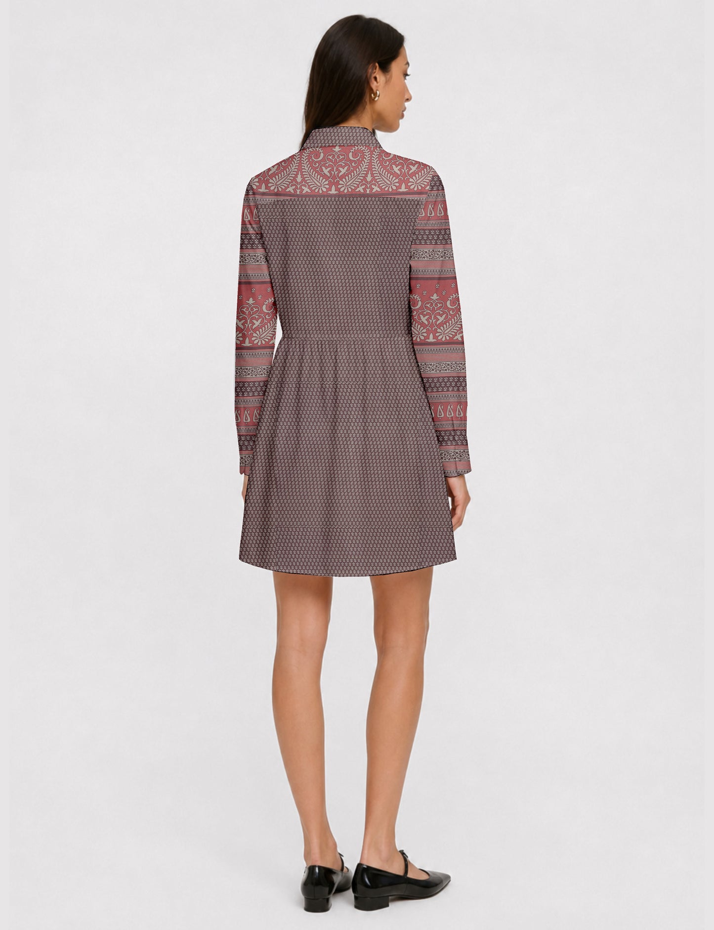 Short shirt dress with a relaxed A-line silhouette, point collar, partial button placket, gathered waist, side pockets, and full-length cuffed sleeves.