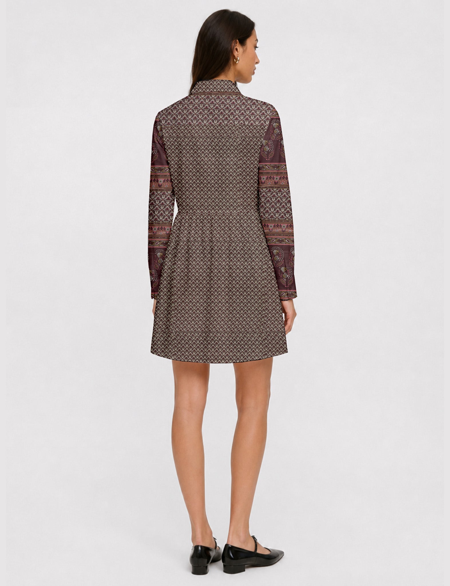 Short shirt dress with a relaxed A-line silhouette, point collar, partial button placket, gathered waist, side pockets, and full-length cuffed sleeves.