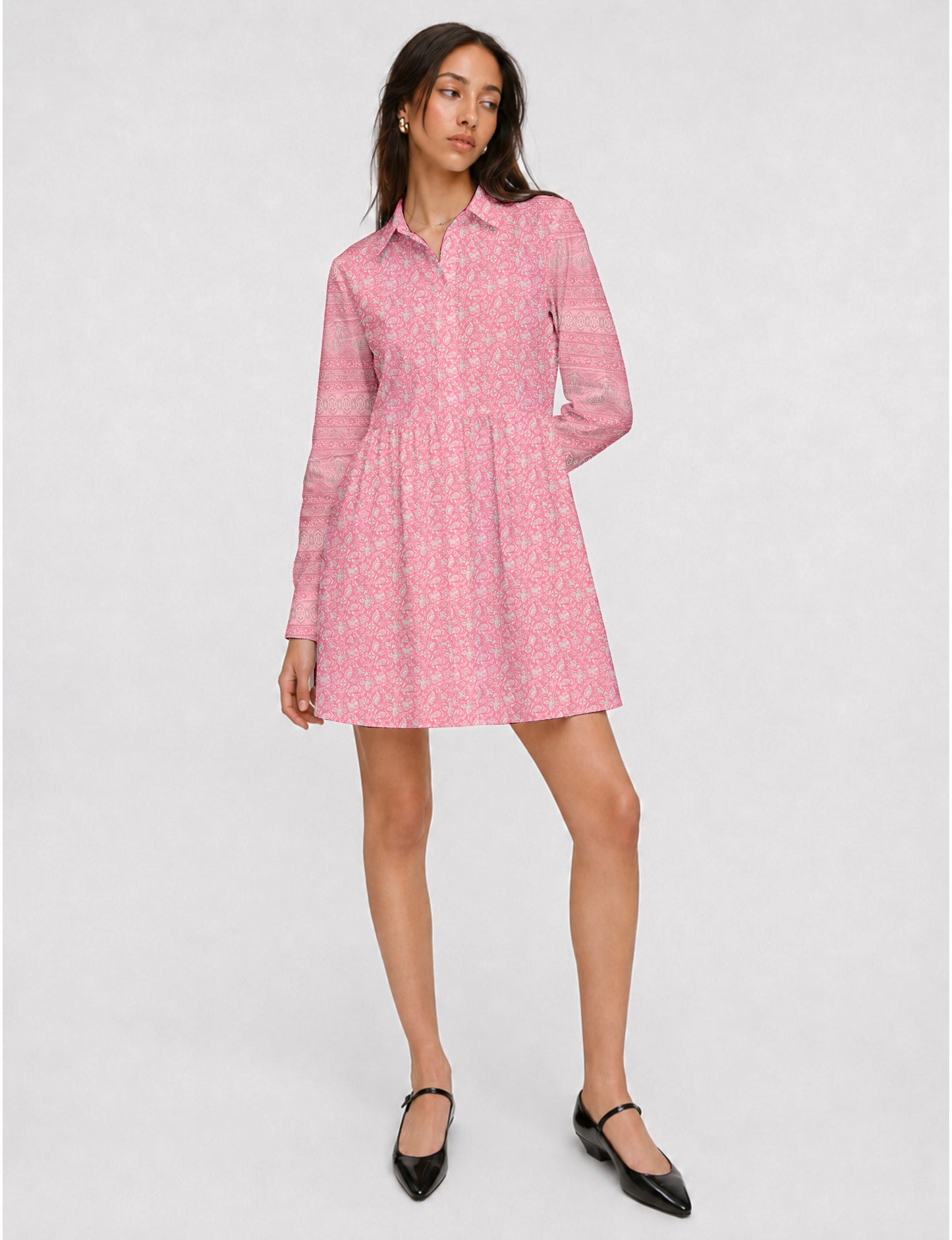 Short shirt dress with a relaxed A-line silhouette, point collar, partial button placket, gathered waist, side pockets, and full-length cuffed sleeves.