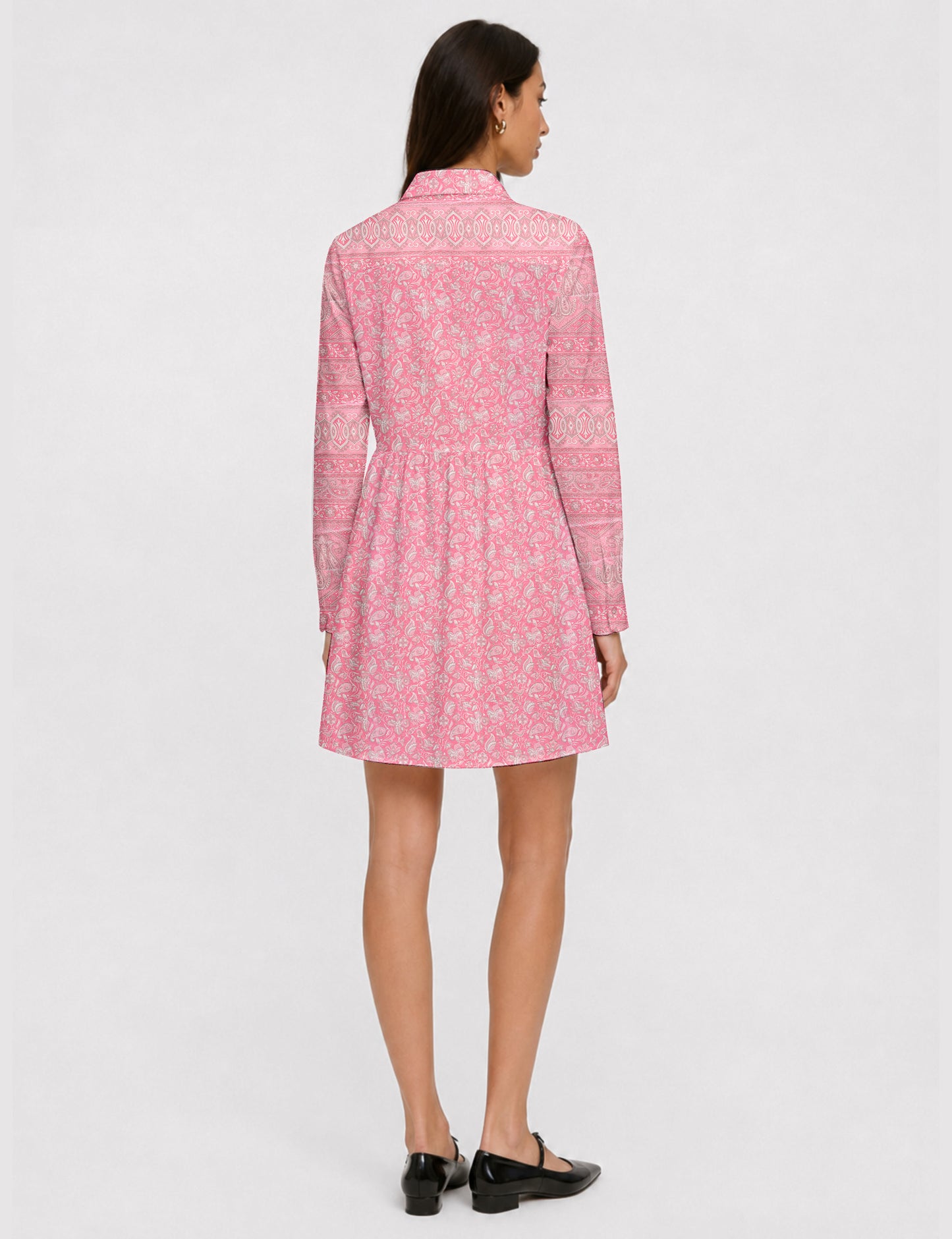 Short shirt dress with a relaxed A-line silhouette, point collar, partial button placket, gathered waist, side pockets, and full-length cuffed sleeves.