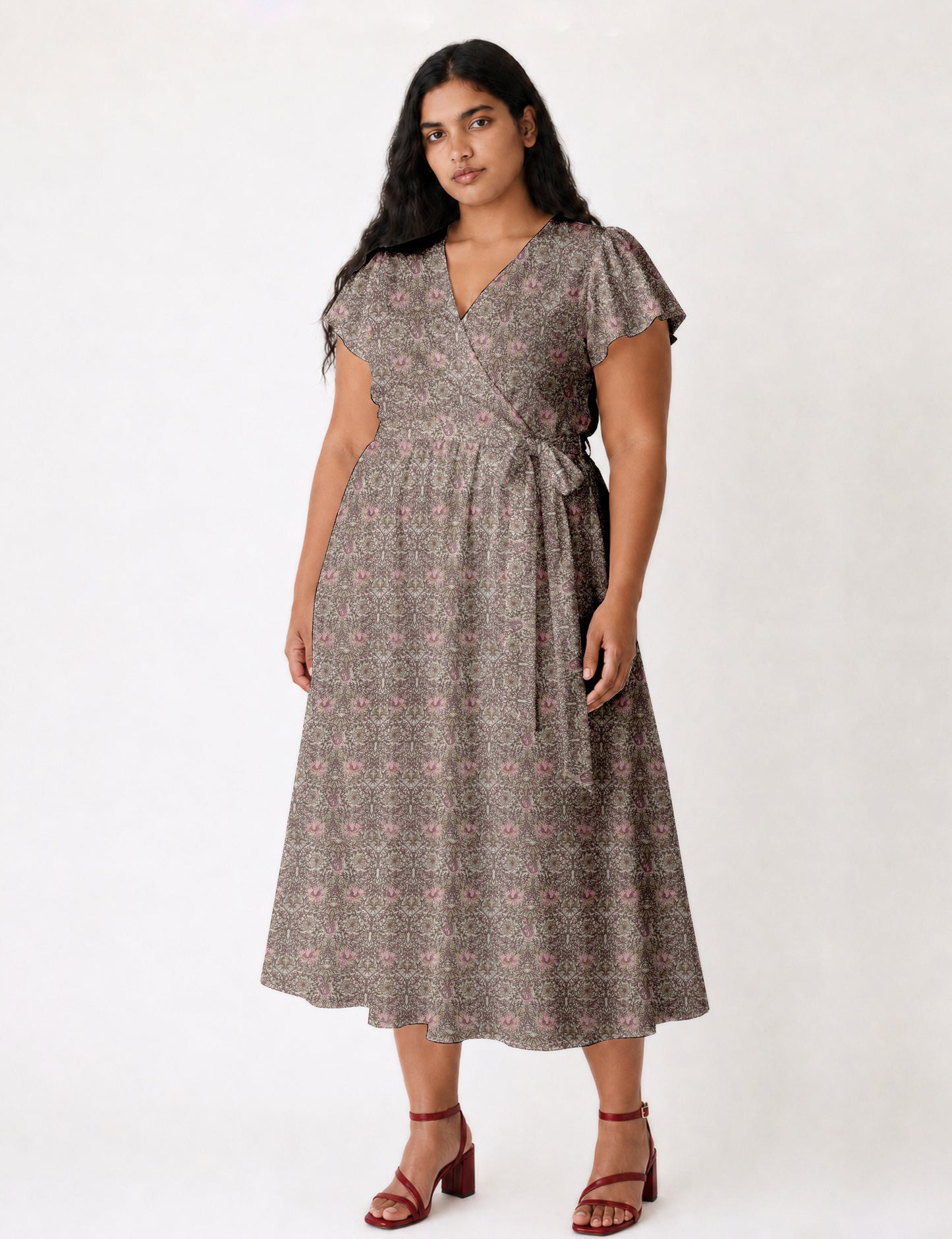 Elegant midi wrap dress with a V-neckline, adjustable waist tie, fitted bodice, and flared skirt for a timeless, flattering silhouette.