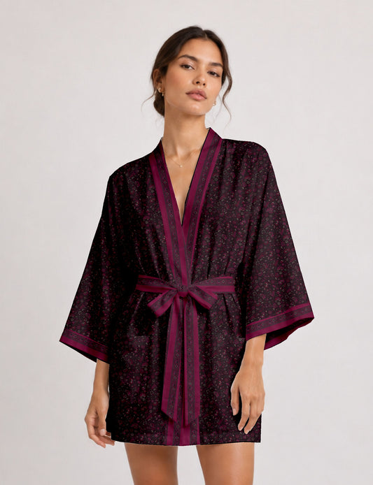 Short kimono robe with wrap front, V-neckline, wide sleeves, waist tie, and concealed skort detail.