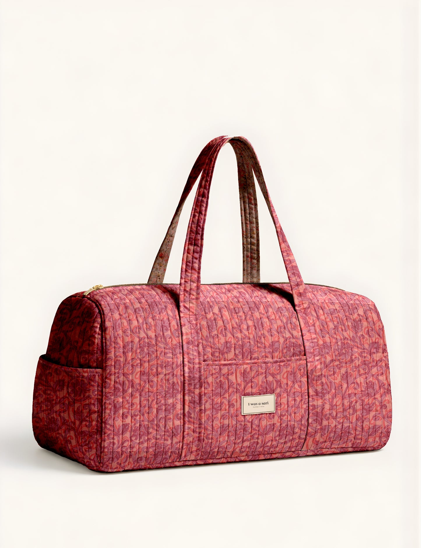 Quilted travel barrel bag with spacious interior and dual handles
Stylish quilted barrel handbag for daily use and short trips
Quilted barrel duffle-style bag with zip closure and inner pouch
I was a Sari quilted barrel bag front view showing structured shape
Quilted barrel bag side view highlighting size and handle drop
Open quilted barrel bag showing spacious interior and pouch