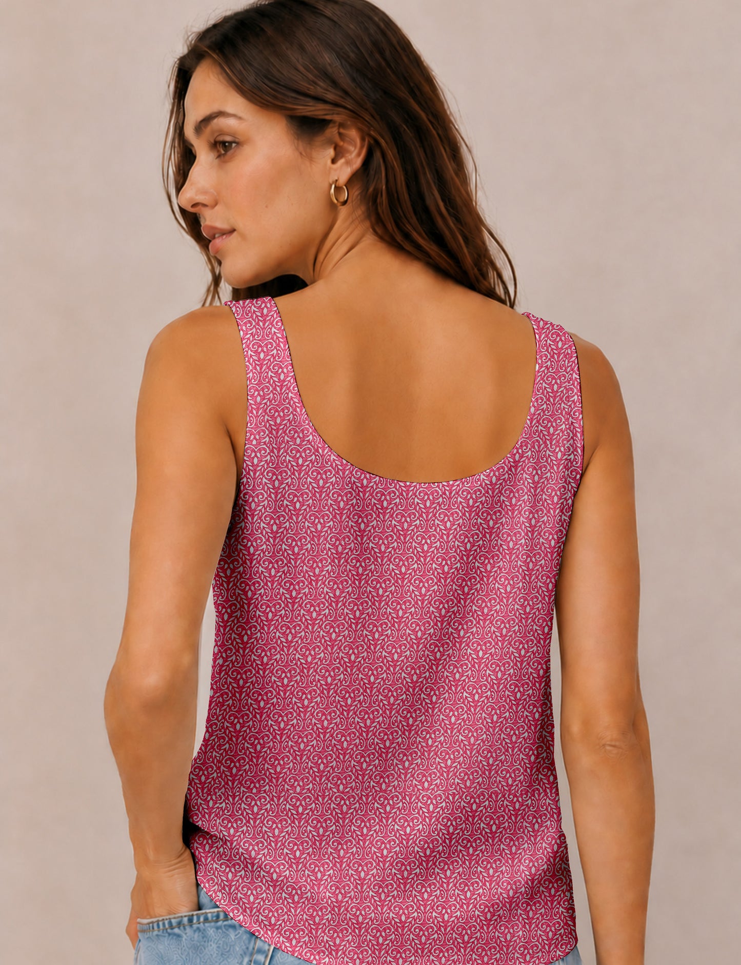 Women's sleeveless blouse with a relaxed straight fit, wide scoop neckline, deep scoop back, and hip-length silhouette.