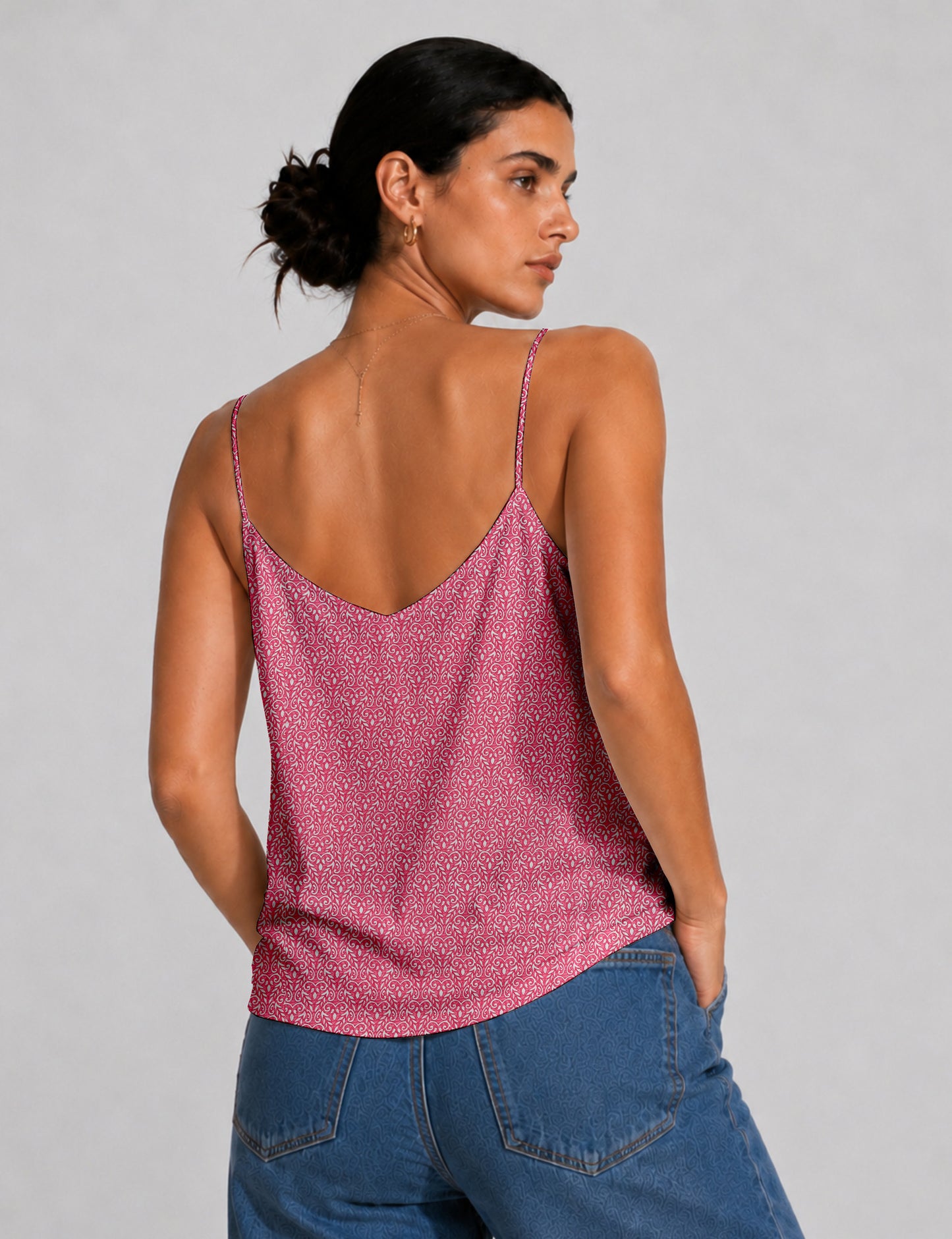 Women's sleeveless slip top with a relaxed straight fit, soft V-neckline, deep V-back, and delicate spaghetti straps.