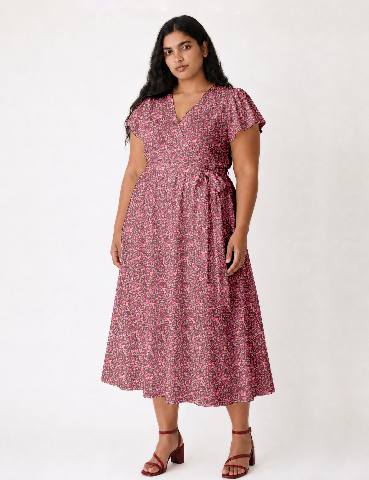 Elegant midi wrap dress with a V-neckline, adjustable waist tie, fitted bodice, and flared skirt for a timeless, flattering silhouette.