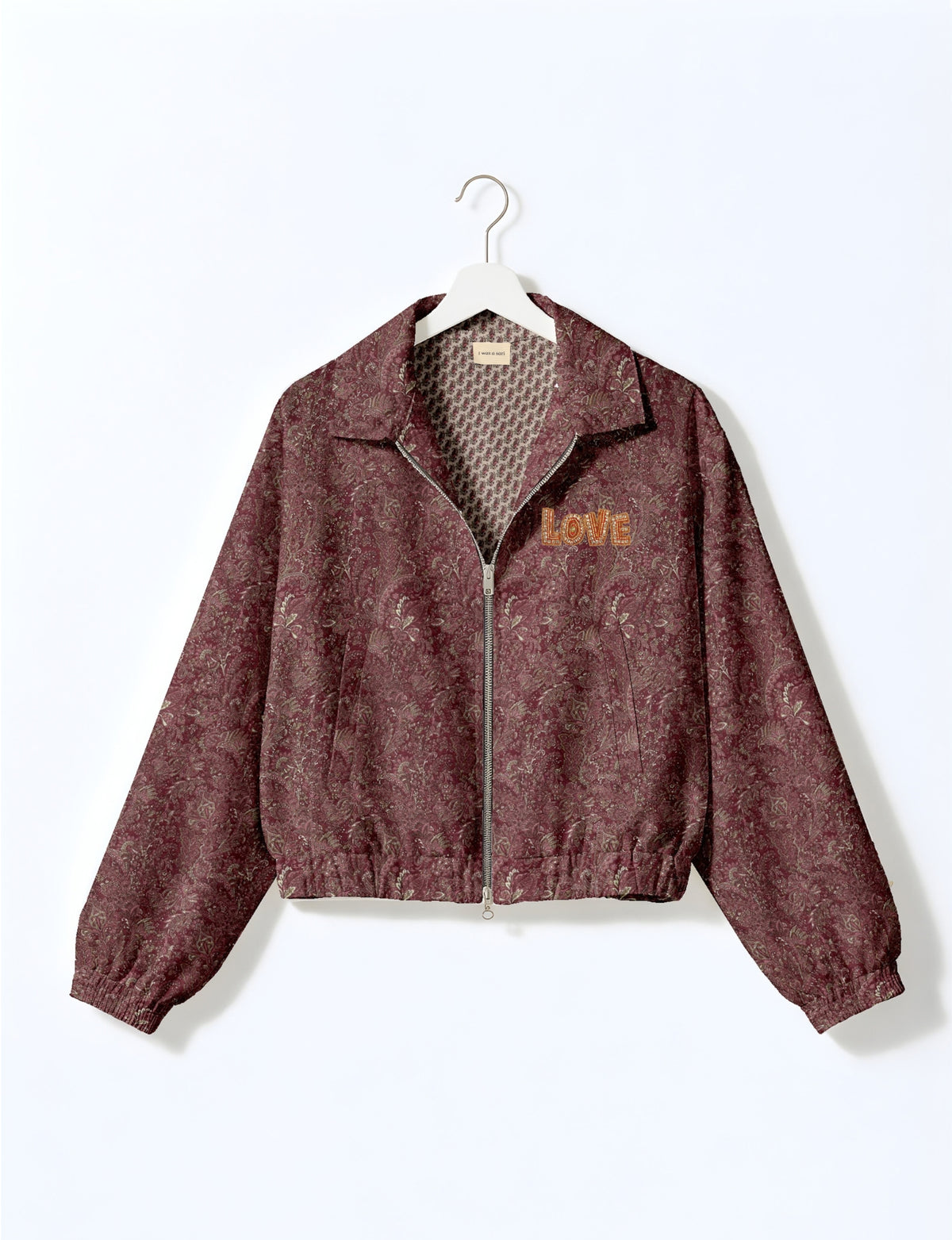 Love Bomber Jacket made from recycled fabric, featuring hand-stitched Aari embroidery. A unique piece of zero-waste clothing, part of the circular fashion movement. Designed with upcycled materials for a stylish yet environmentally friendly clothing choice.
