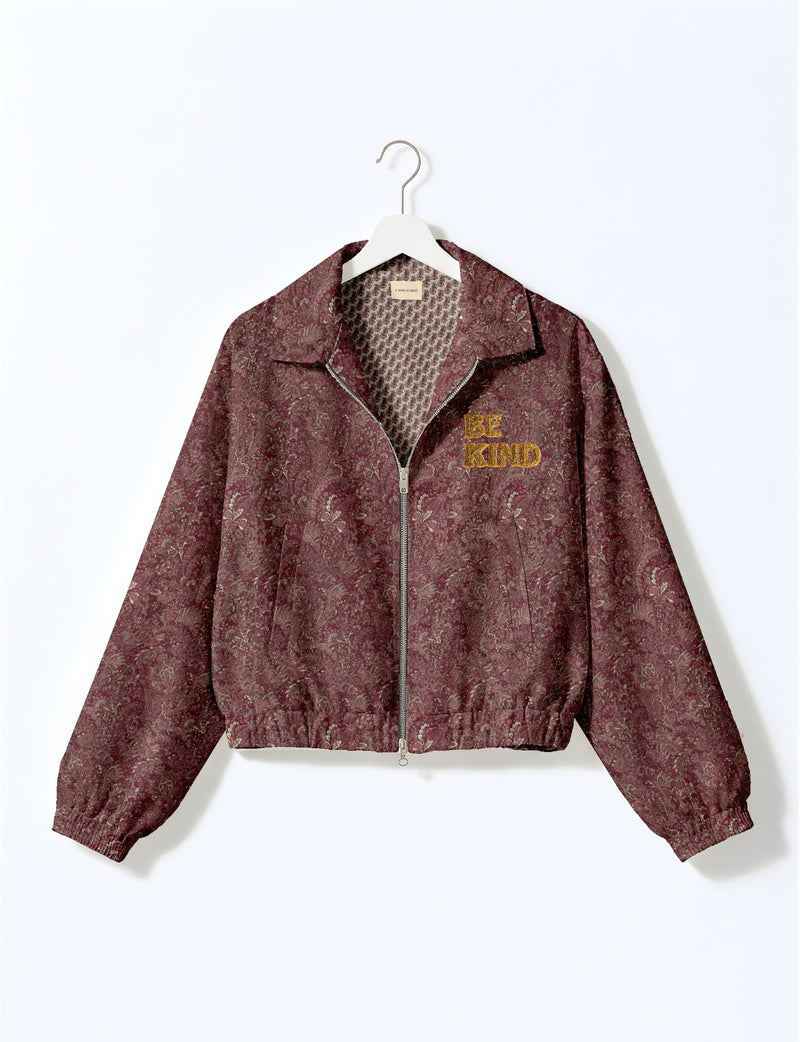 BE KIND Bomber jacket made from upcycled sari fabric with handcrafted Aari embroidery by female artisans.