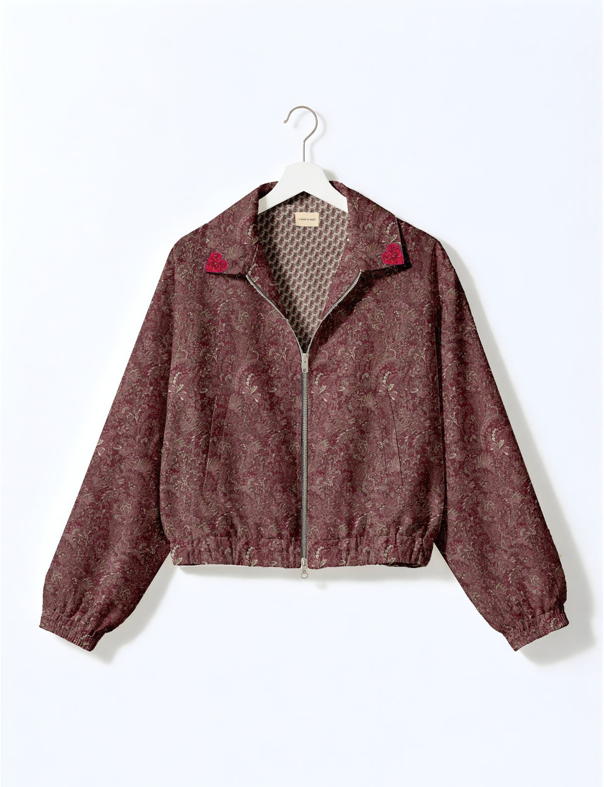 Love Bomber Jacket made from recycled fabric, featuring hand-stitched Aari embroidery. A unique piece of zero-waste clothing, part of the circular fashion movement. Designed with upcycled materials for a stylish yet environmentally friendly clothing choice.