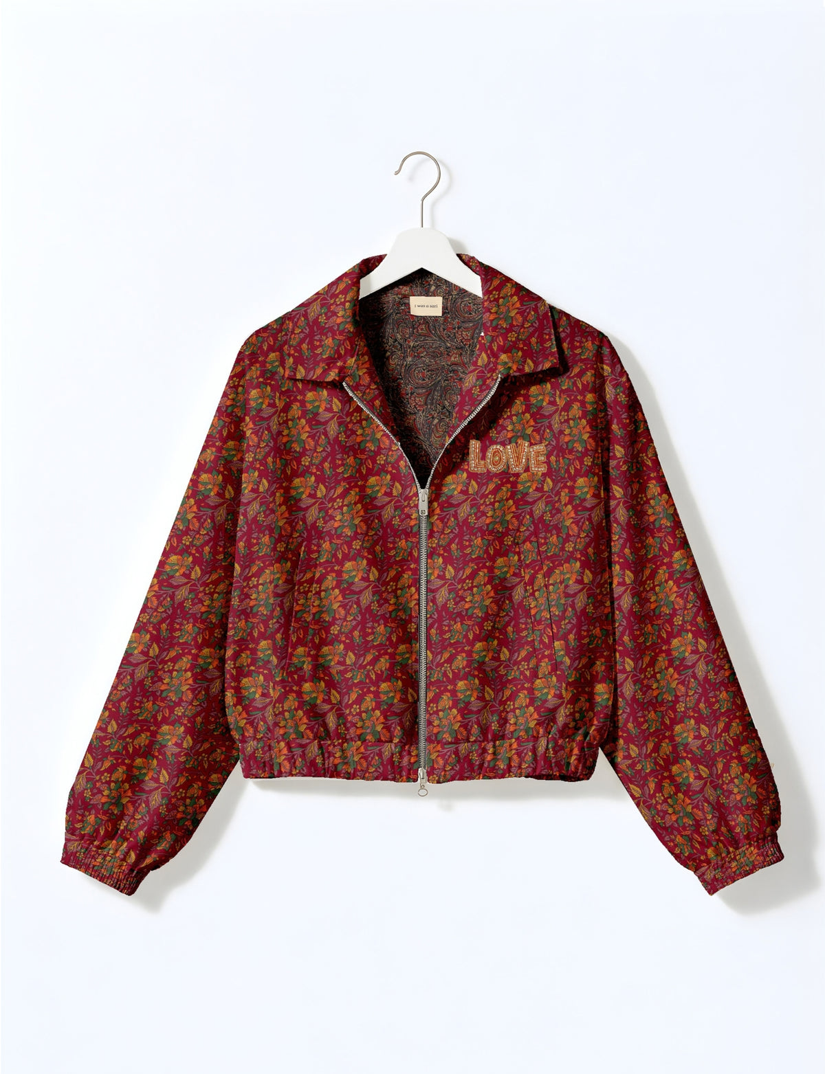 Love Bomber Jacket made from recycled fabric, featuring hand-stitched Aari embroidery. A unique piece of zero-waste clothing, part of the circular fashion movement. Designed with upcycled materials for a stylish yet environmentally friendly clothing choice.