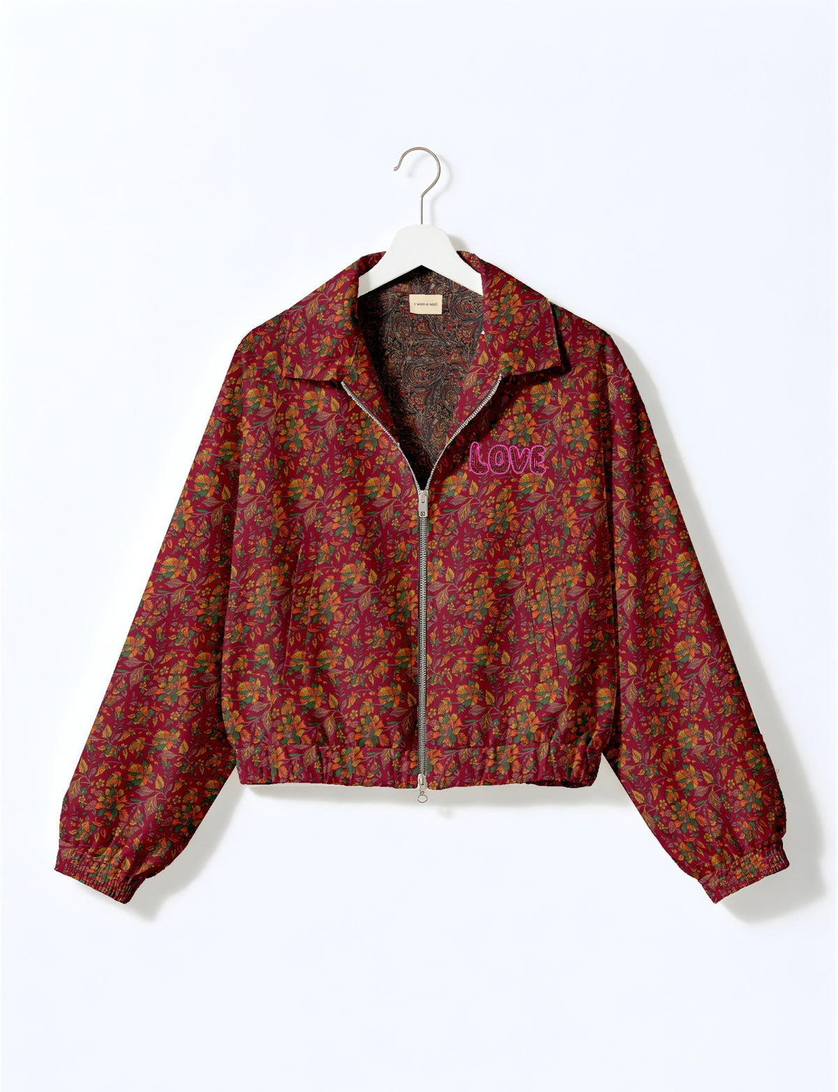 Love Bomber Jacket made from recycled fabric, featuring hand-stitched Aari embroidery. A unique piece of zero-waste clothing, part of the circular fashion movement. Designed with upcycled materials for a stylish yet environmentally friendly clothing choice.