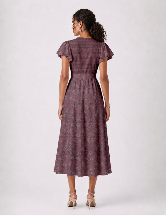 Elegant midi wrap dress with a V-neckline, adjustable waist tie, fitted bodice, and flared skirt for a timeless, flattering silhouette.