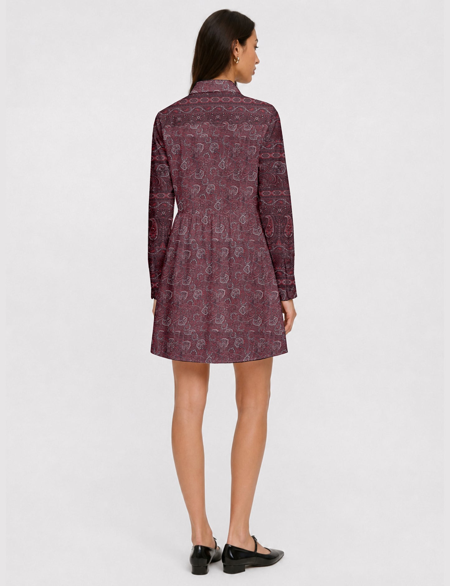 Short shirt dress with a relaxed A-line silhouette, point collar, partial button placket, gathered waist, side pockets, and full-length cuffed sleeves.