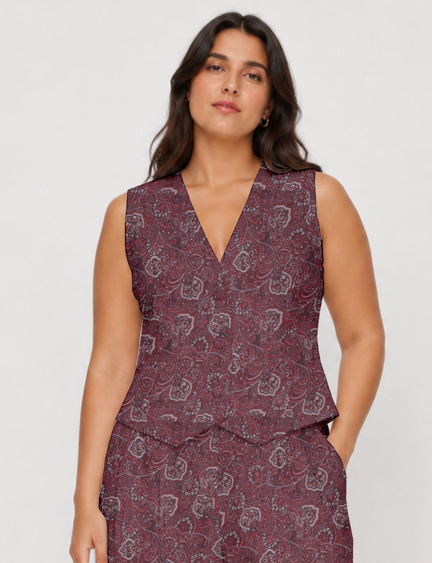 Women's fitted waistcoat with V-neck, single-breasted button closure, tailored silhouette, and pointed hem in sustainable fashion.