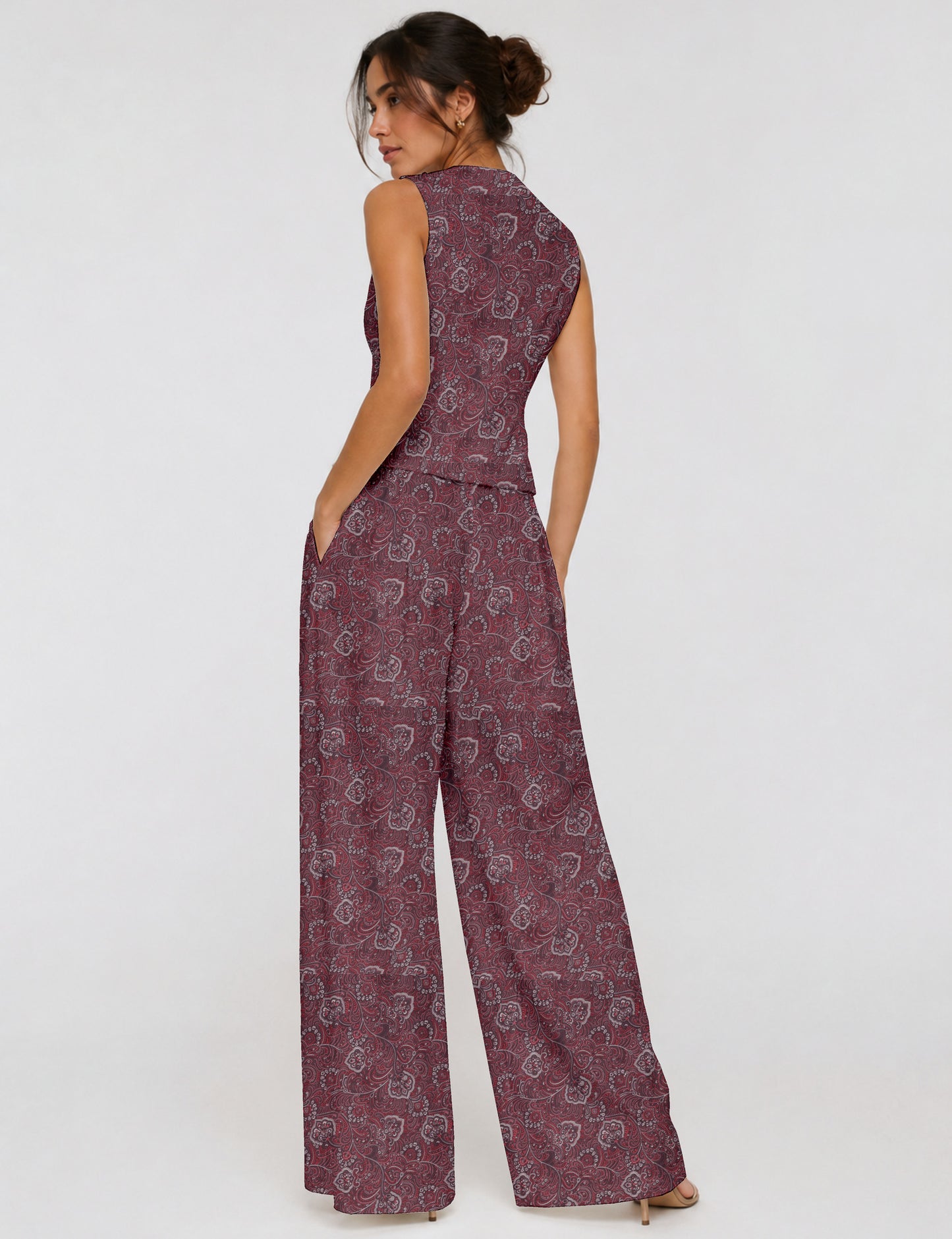 Women's tailored waistcoat set with a sleeveless V-neck button-front waistcoat and high-rise wide leg trousers in a coordinated matching outfit.