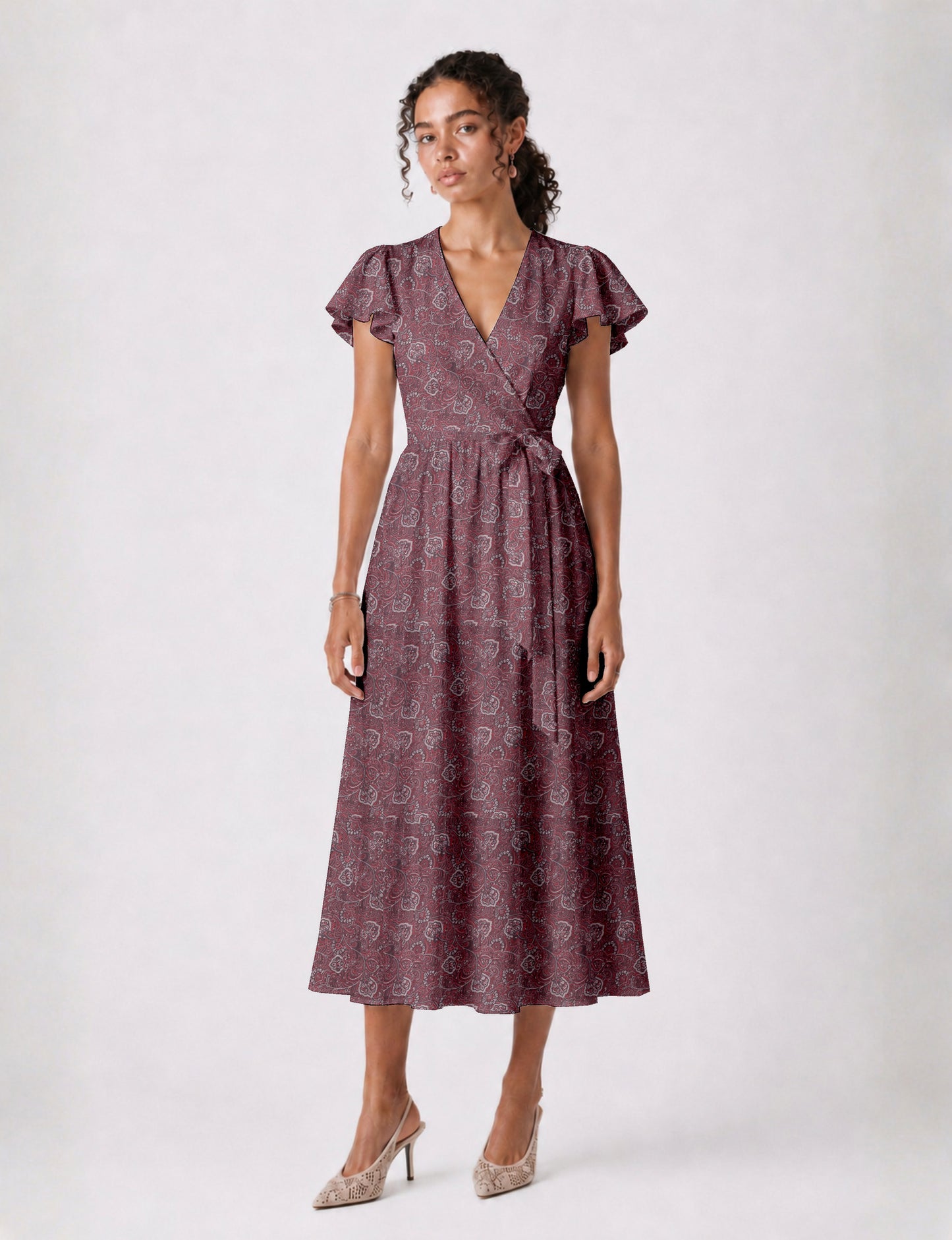 Elegant midi wrap dress with a V-neckline, adjustable waist tie, fitted bodice, and flared skirt for a timeless, flattering silhouette.