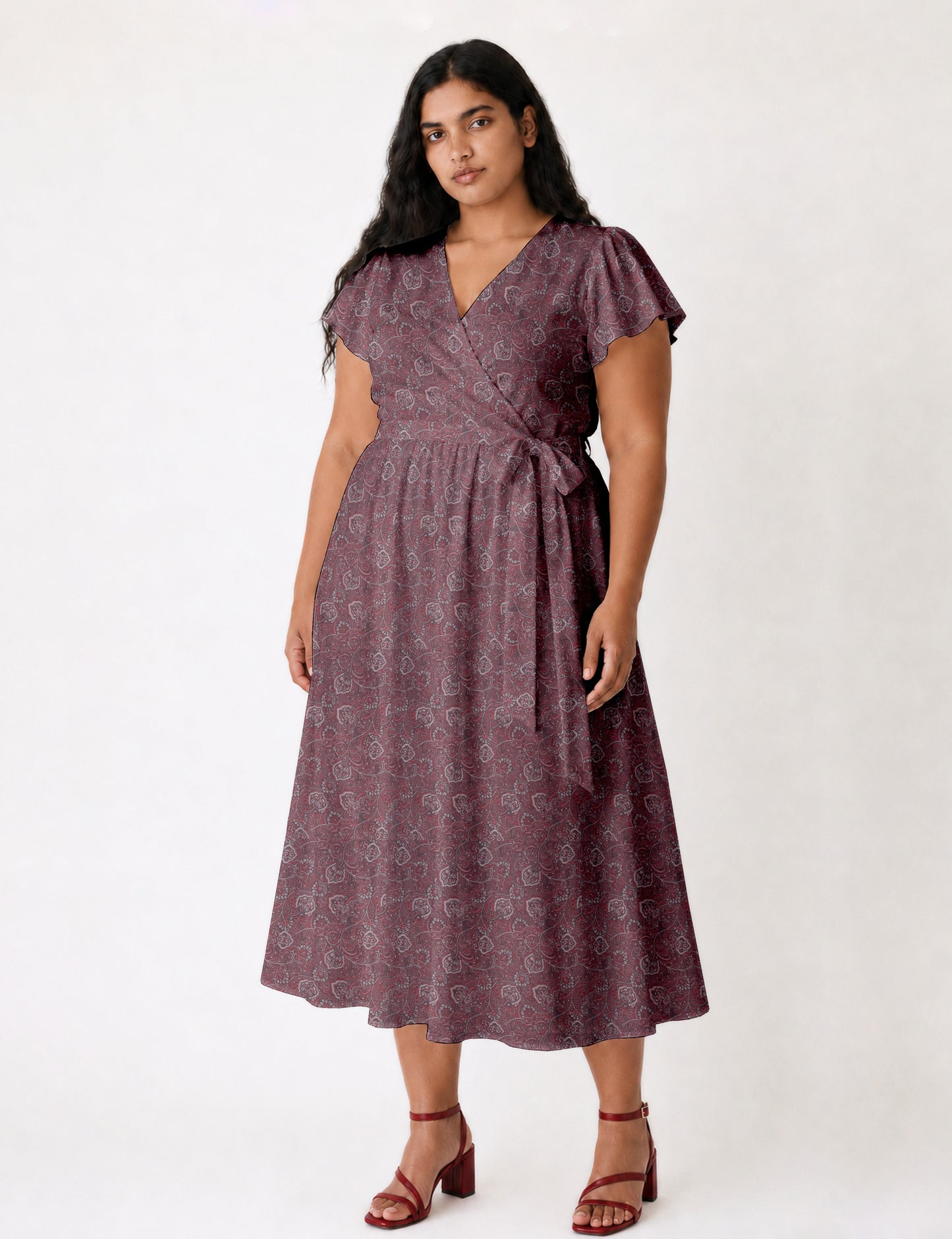 Elegant midi wrap dress with a V-neckline, adjustable waist tie, fitted bodice, and flared skirt for a timeless, flattering silhouette.