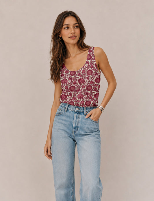 Women's sleeveless blouse with a relaxed straight fit, wide scoop neckline, deep scoop back, and hip-length silhouette.