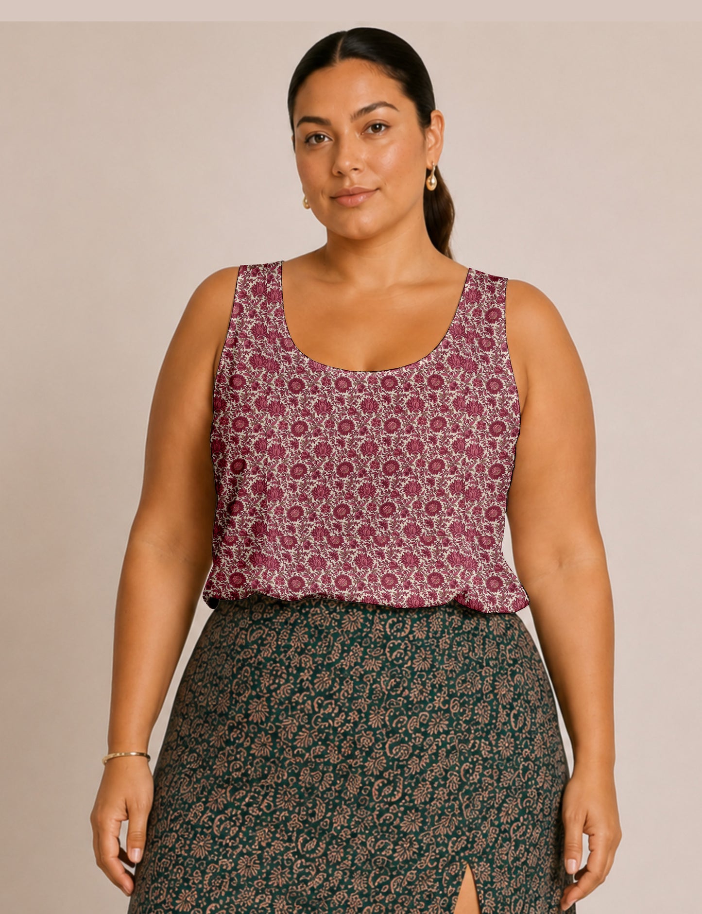 Women's sleeveless blouse with a relaxed straight fit, wide scoop neckline, deep scoop back, and hip-length silhouette.