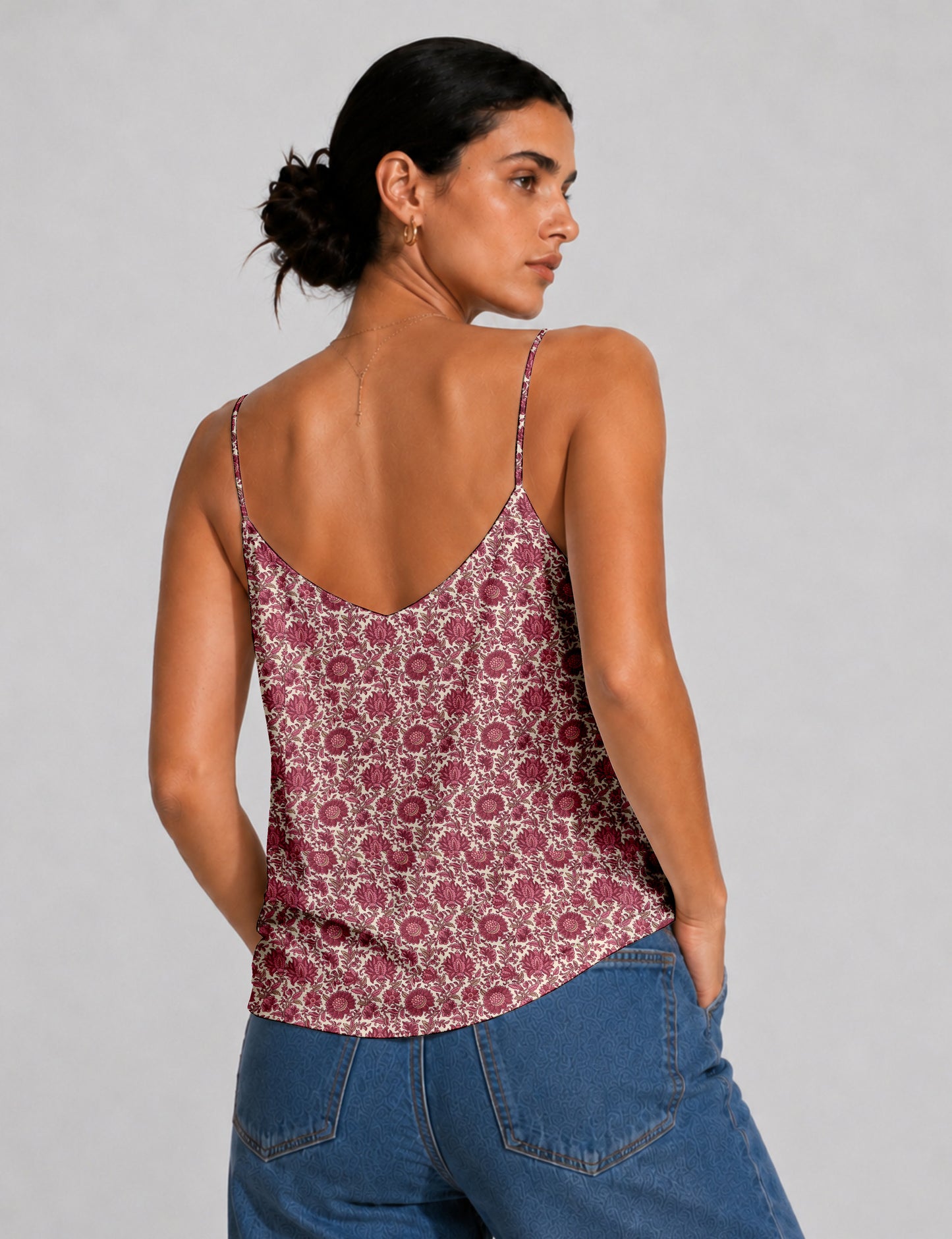 Women's sleeveless slip top with a relaxed straight fit, soft V-neckline, deep V-back, and delicate spaghetti straps.