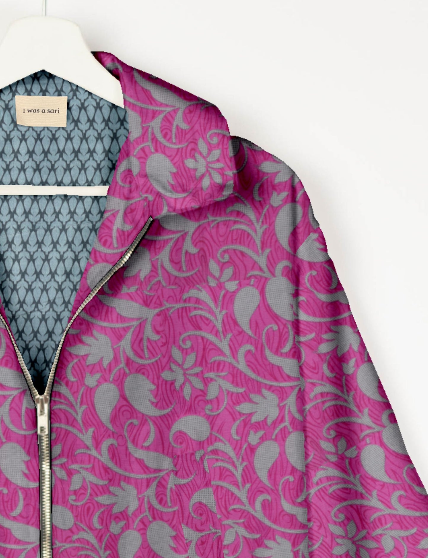 Upcycled Bomber Jacket made from recycled sari materials, featuring a cute cropped shape, elasticated hem and cuffs, and contrast sari print lining. Sustainable apparel promoting eco-friendly fashion and ethical clothing.