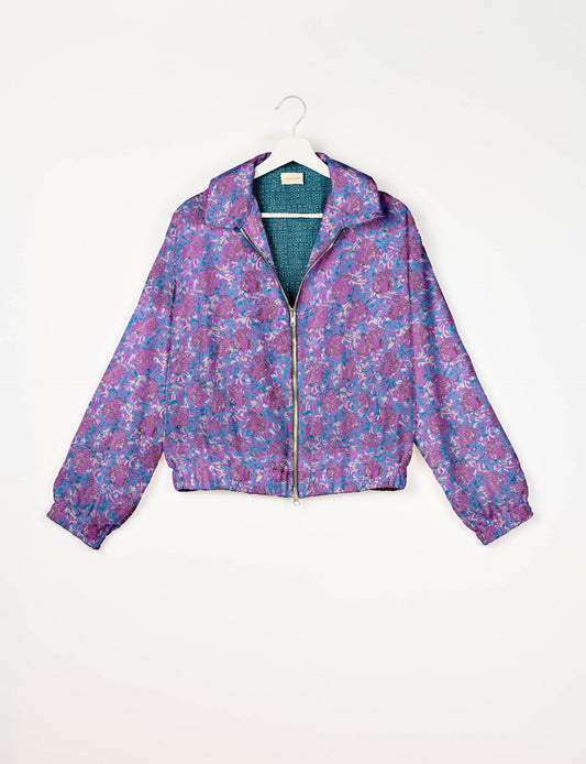 Upcycled Bomber Jacket made from recycled sari materials, featuring a cute cropped shape, elasticated hem and cuffs, and contrast sari print lining. Sustainable apparel promoting eco-friendly fashion and ethical clothing.