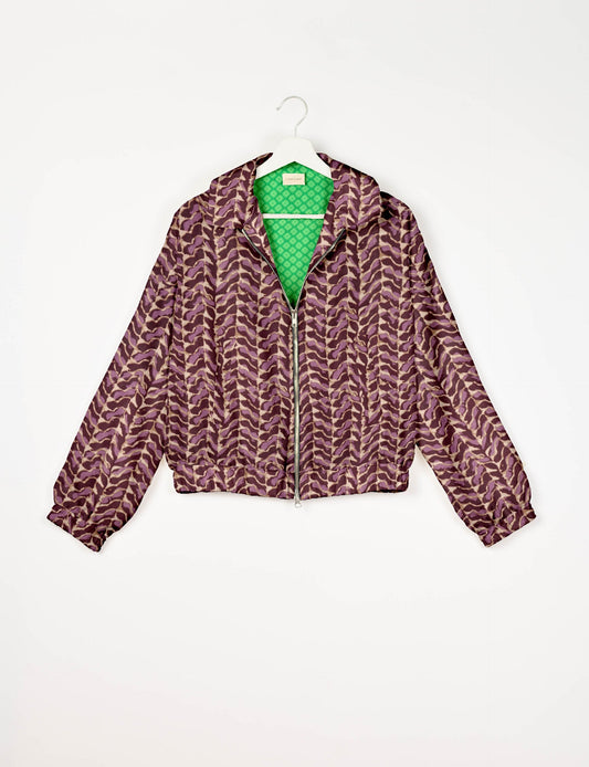 Upcycled Bomber Jacket made from recycled sari materials, featuring a cute cropped shape, elasticated hem and cuffs, and contrast sari print lining. Sustainable apparel promoting eco-friendly fashion and ethical clothing.
