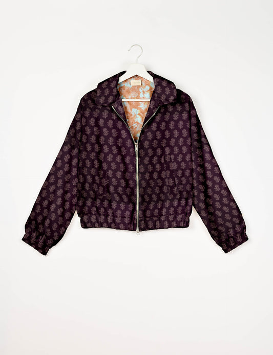 Upcycled Bomber Jacket made from recycled sari materials, featuring a cute cropped shape, elasticated hem and cuffs, and contrast sari print lining. Sustainable apparel promoting eco-friendly fashion and ethical clothing.