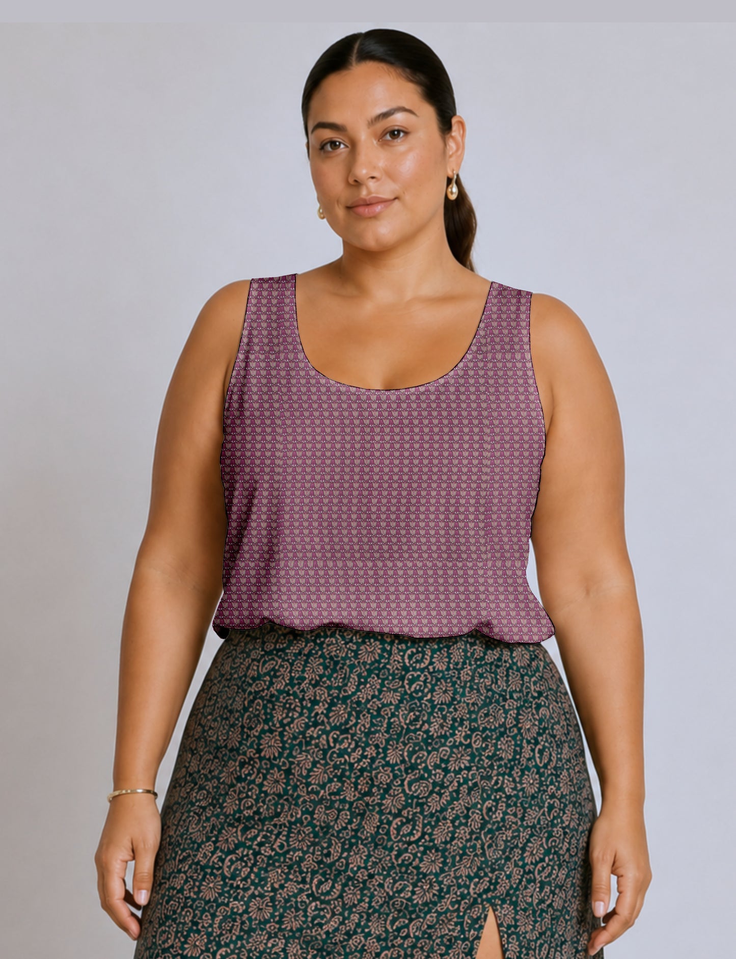 Women's sleeveless blouse with a relaxed straight fit, wide scoop neckline, deep scoop back, and hip-length silhouette.