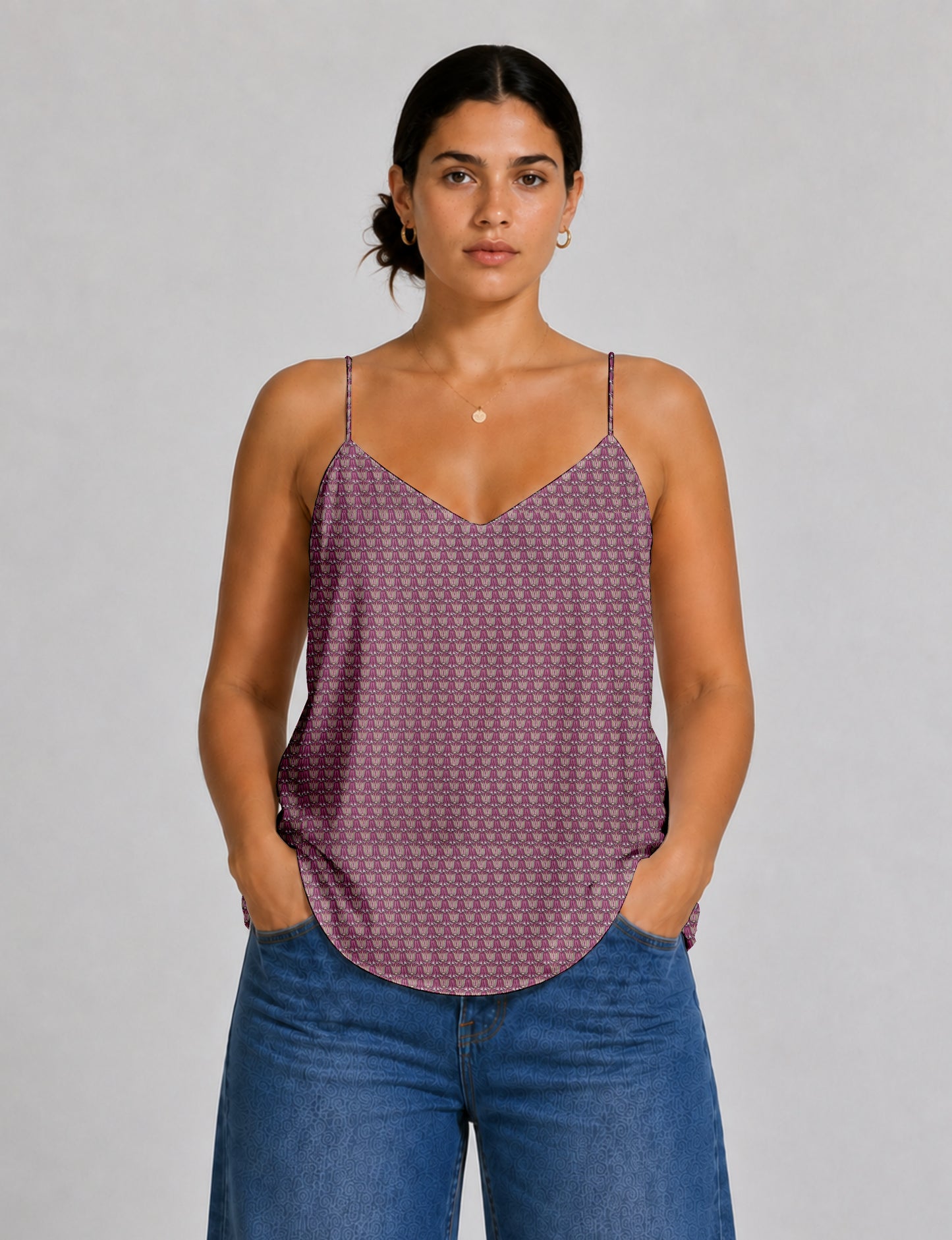 Women's sleeveless slip top with a relaxed straight fit, soft V-neckline, deep V-back, and delicate spaghetti straps.