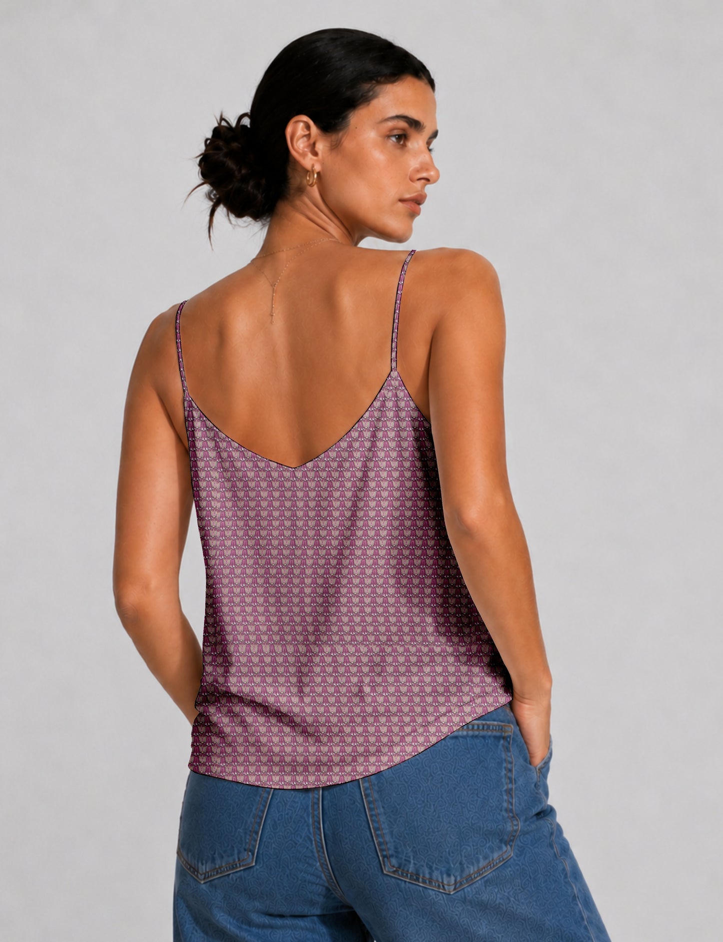 Women's sleeveless slip top with a relaxed straight fit, soft V-neckline, deep V-back, and delicate spaghetti straps.