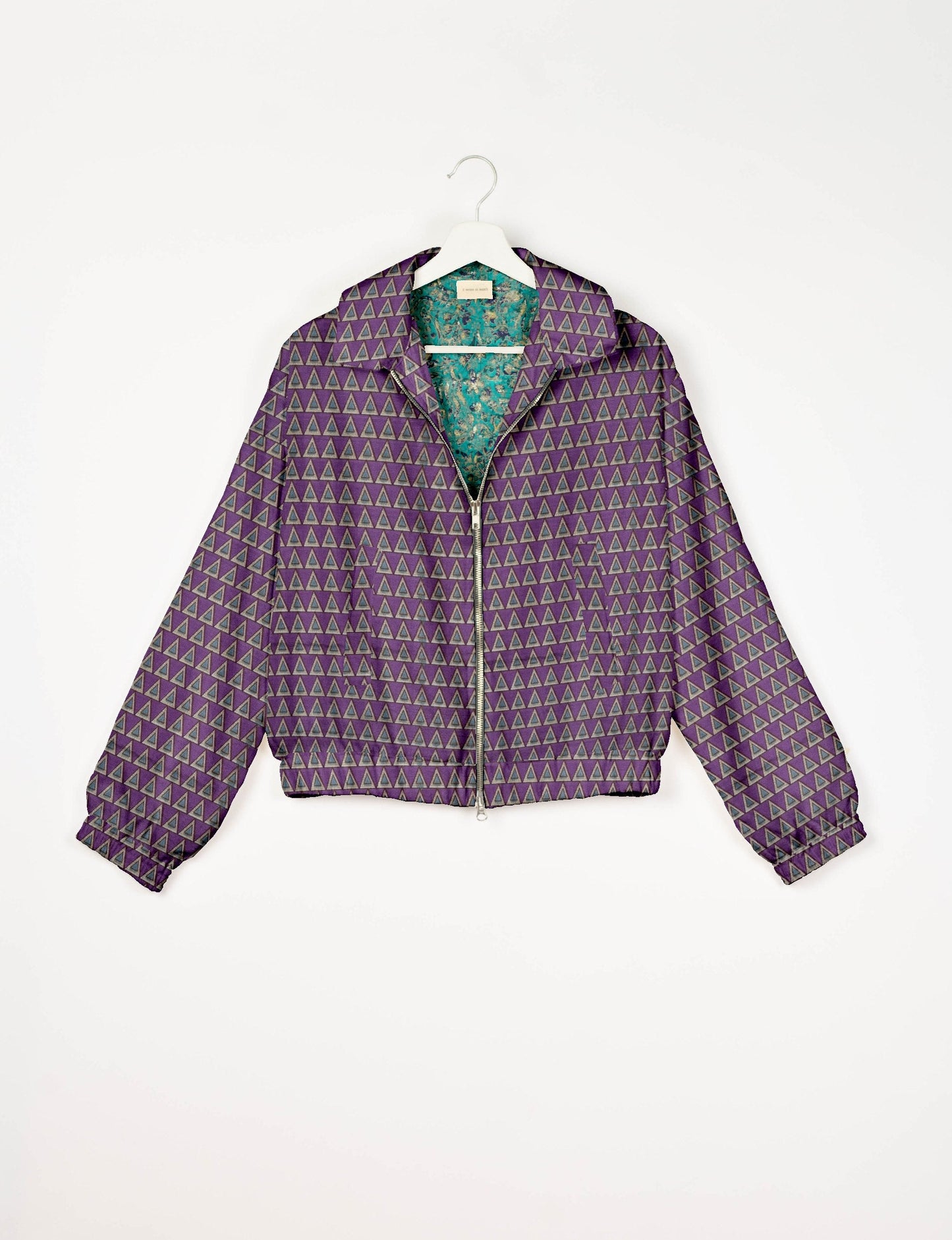 Upcycled Bomber Jacket made from recycled sari materials, featuring a cute cropped shape, elasticated hem and cuffs, and contrast sari print lining. Sustainable apparel promoting eco-friendly fashion and ethical clothing.